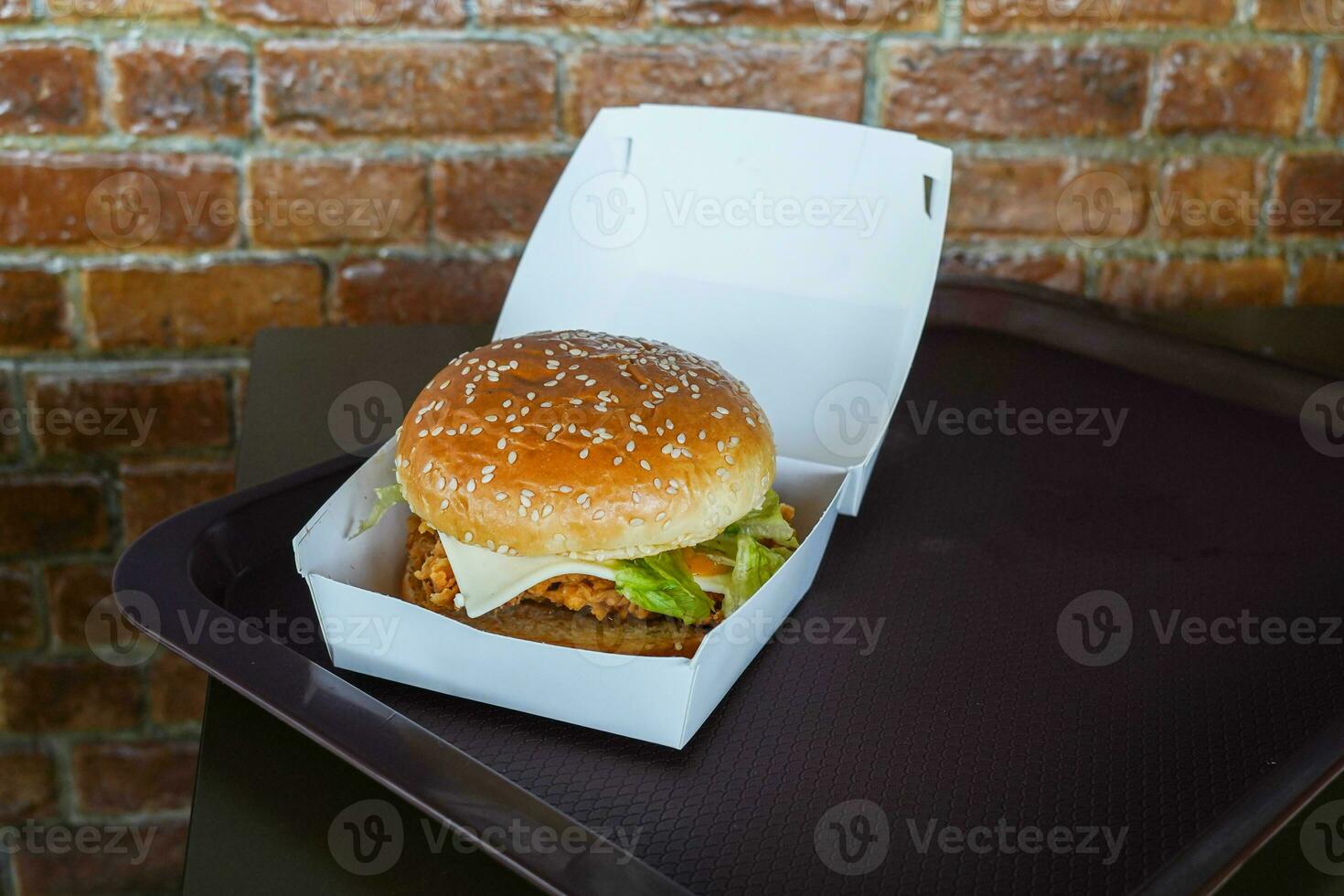 Fresh tasty burgers in a white paper box feeder photo