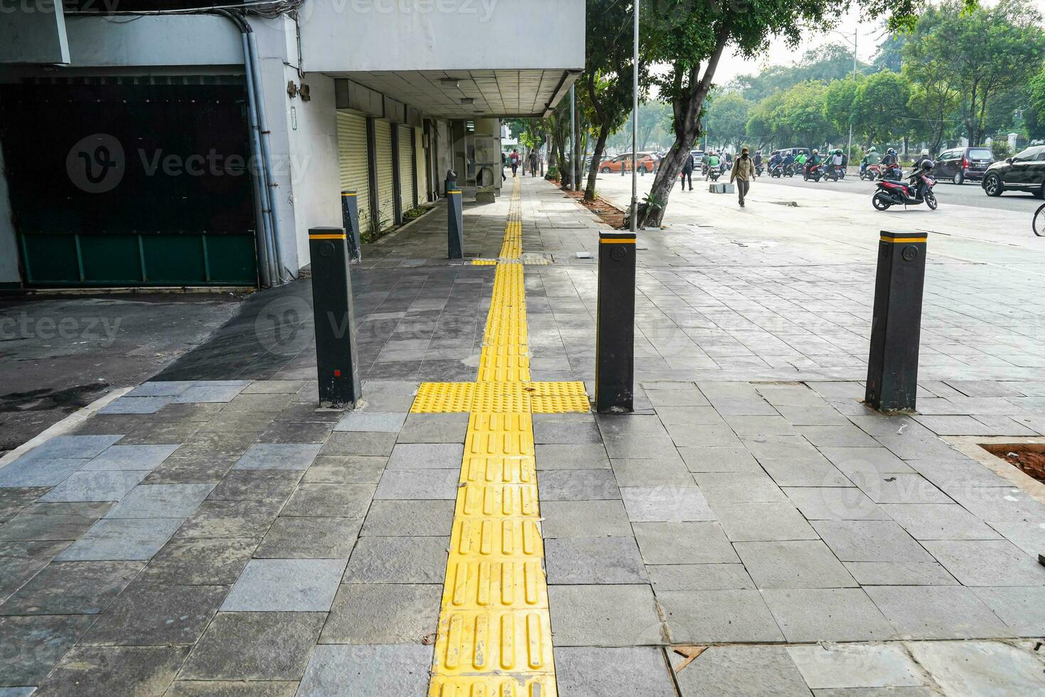 Pedestrian paths, Braille block in tactile paving for the blind handicapped in tiled pathways, paths for the blind. photo