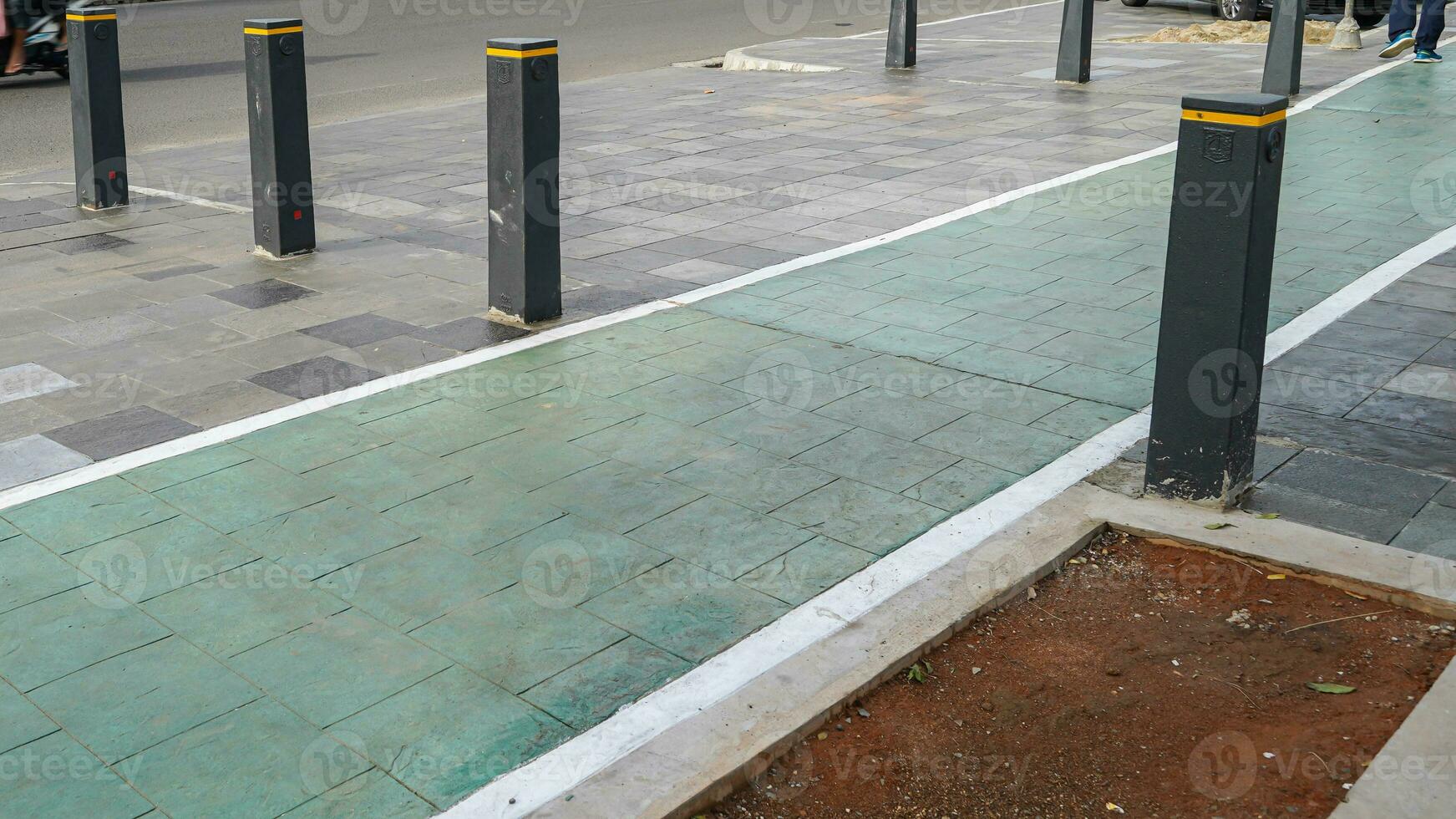 bicycle lane, traffic, city transportation and eco-friendly concept, green bicycle lane with bicycle signs photo