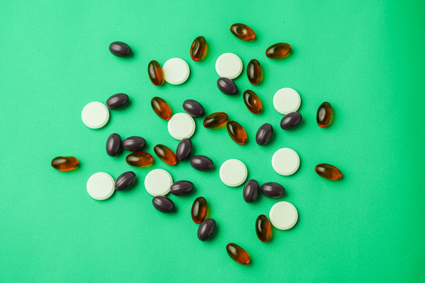 Many different tablet pills on color background, flat lay, with copy space. photo