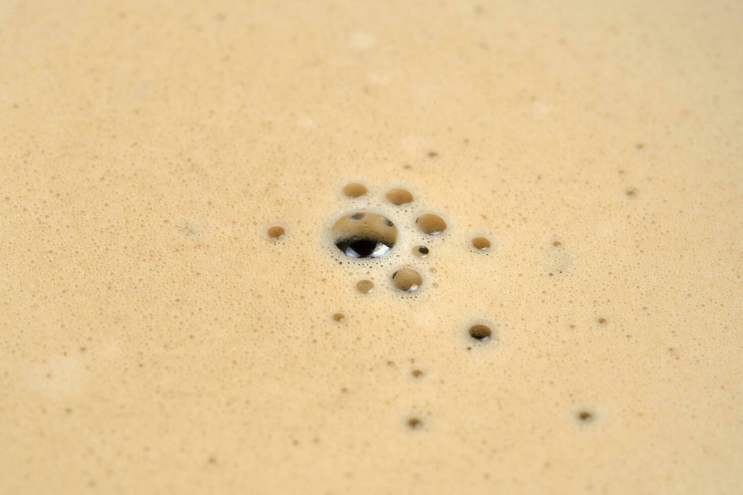 Top view of coffee foam in the cup photo