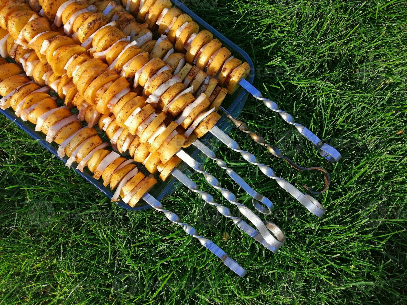 pickled potatoes and lard on skewers photo