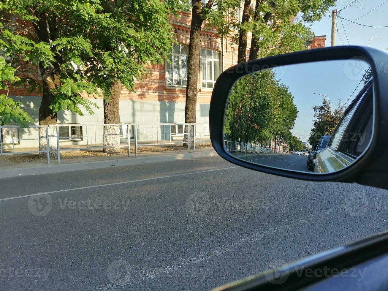 side mirror of vehicles. view from the car photo