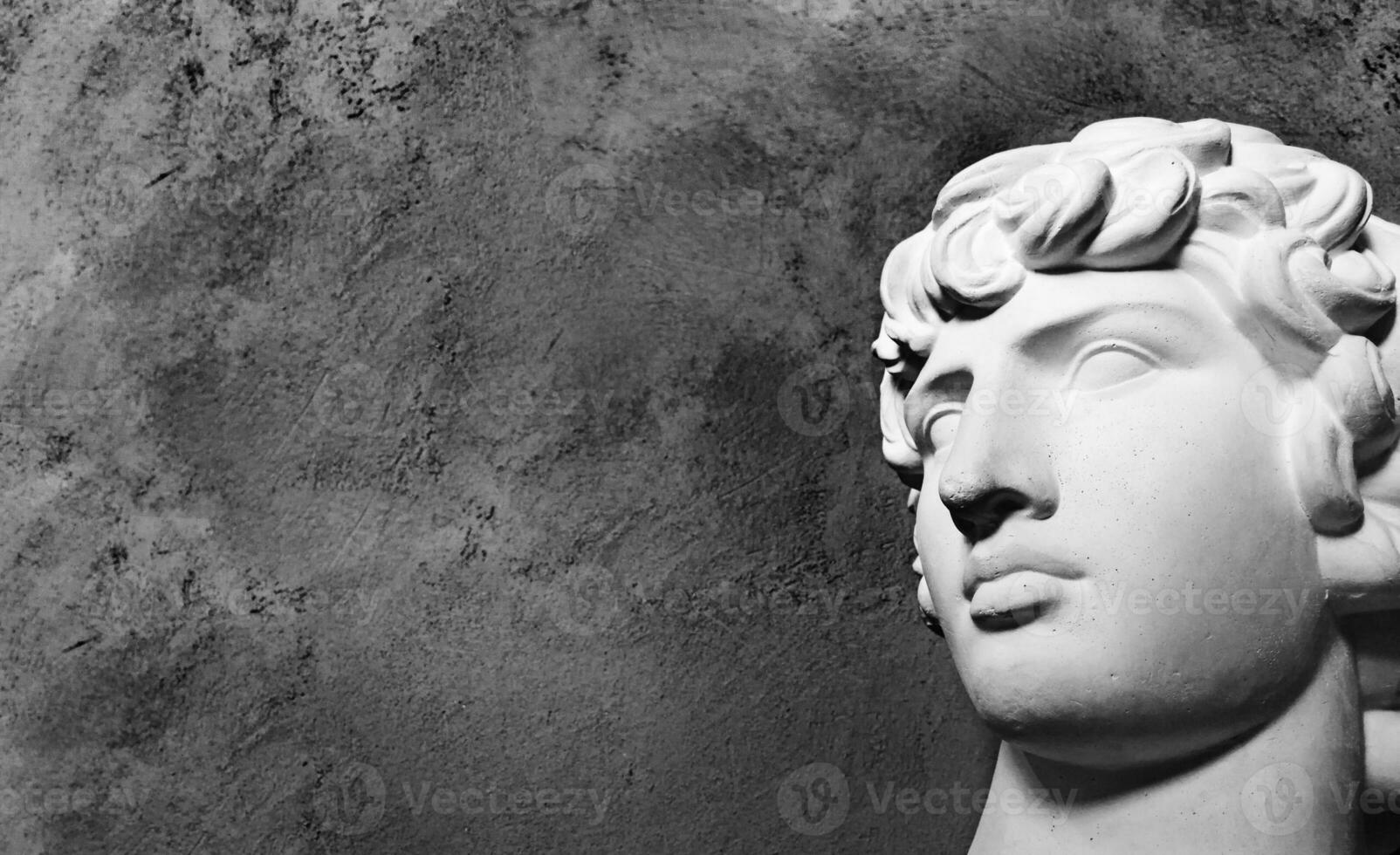 Greek sculpture of a young man. photo