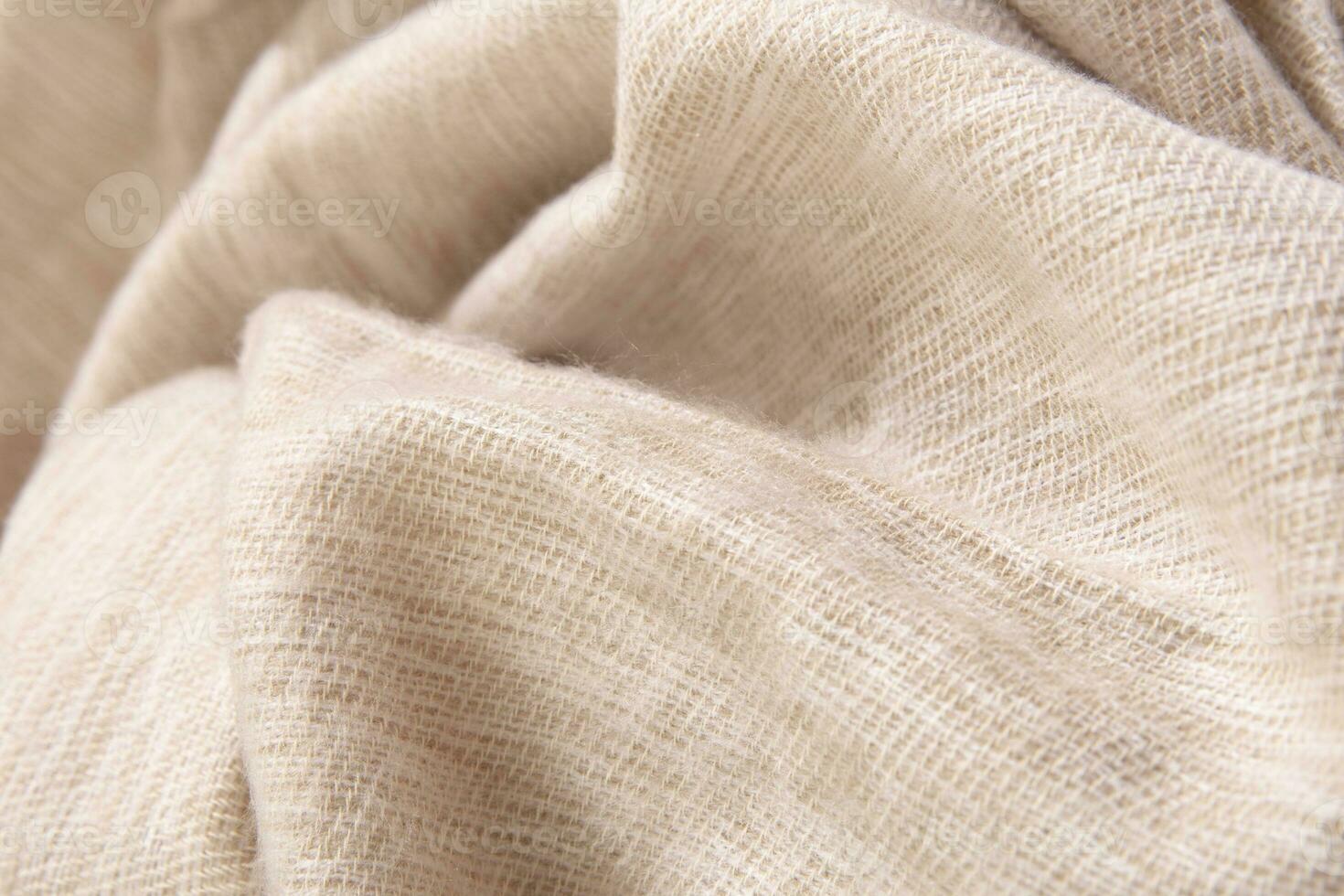 Natural wool cream colored fabric. Cashmere, wool. Texture of natural wool fabric. Knitwear. photo
