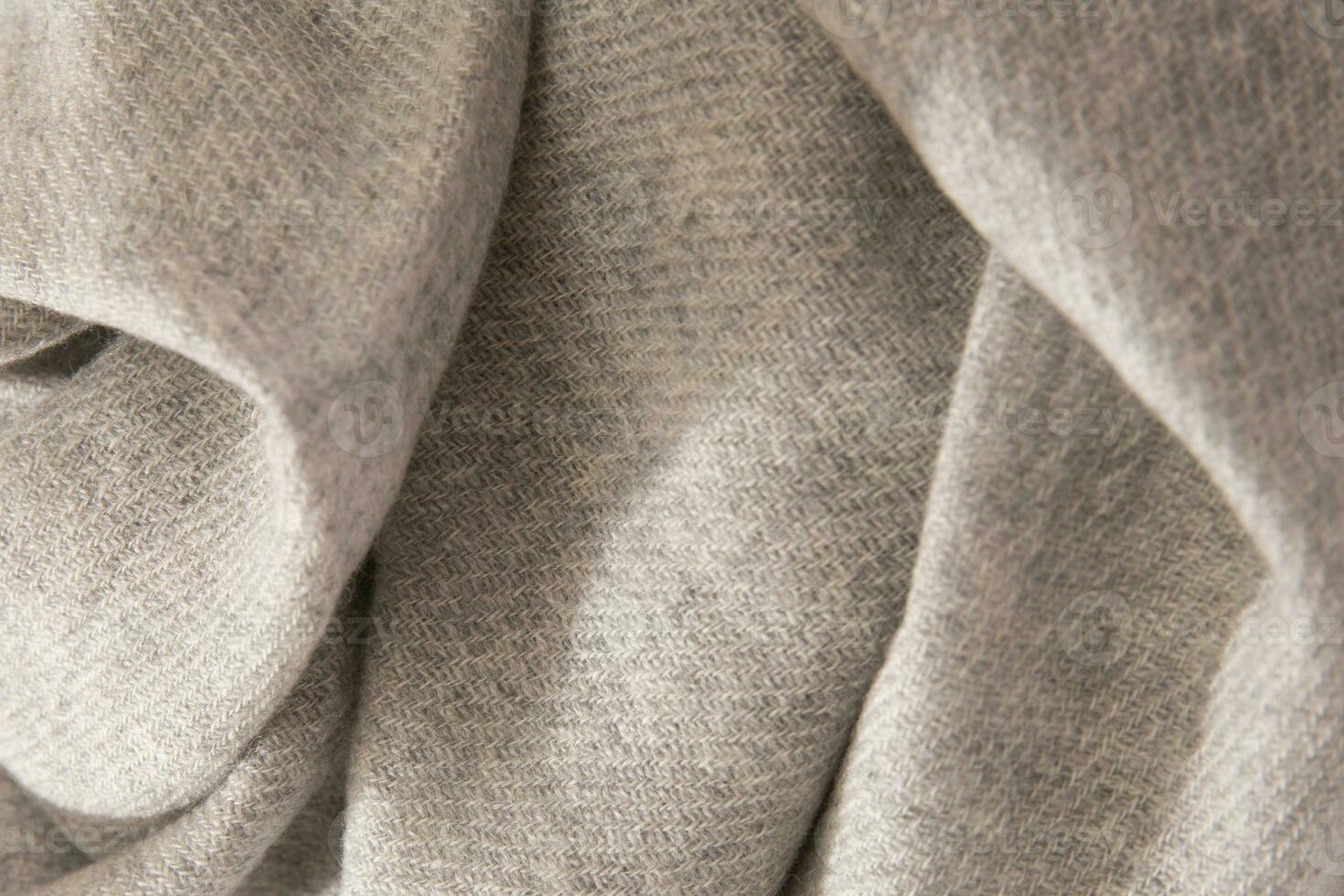Natural wool grey fabric. Cashmere, wool. Texture of natural wool fabric. Knitwear. photo