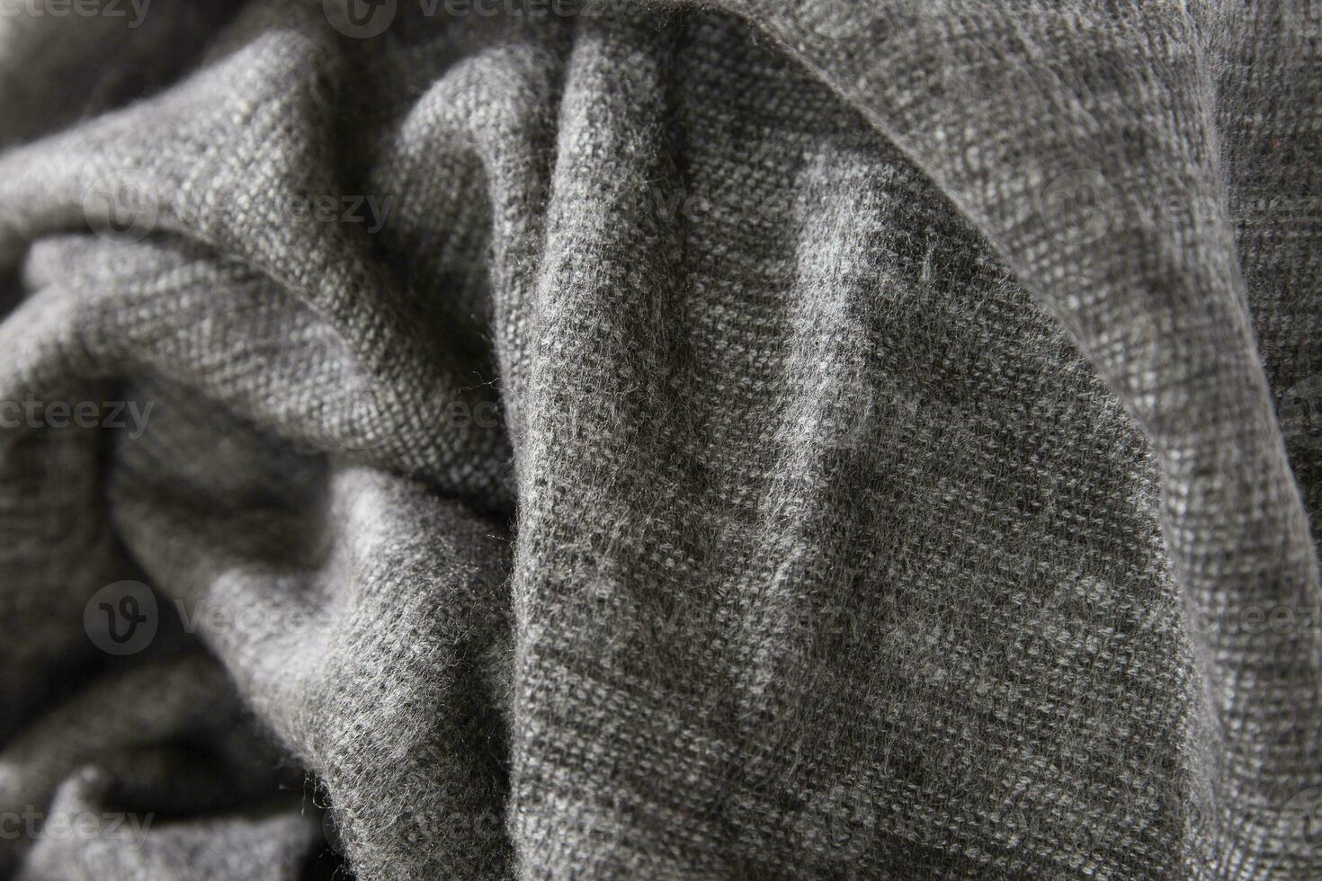 Natural wool black fabric. Cashmere, wool. Texture of natural wool fabric. Knitwear. photo