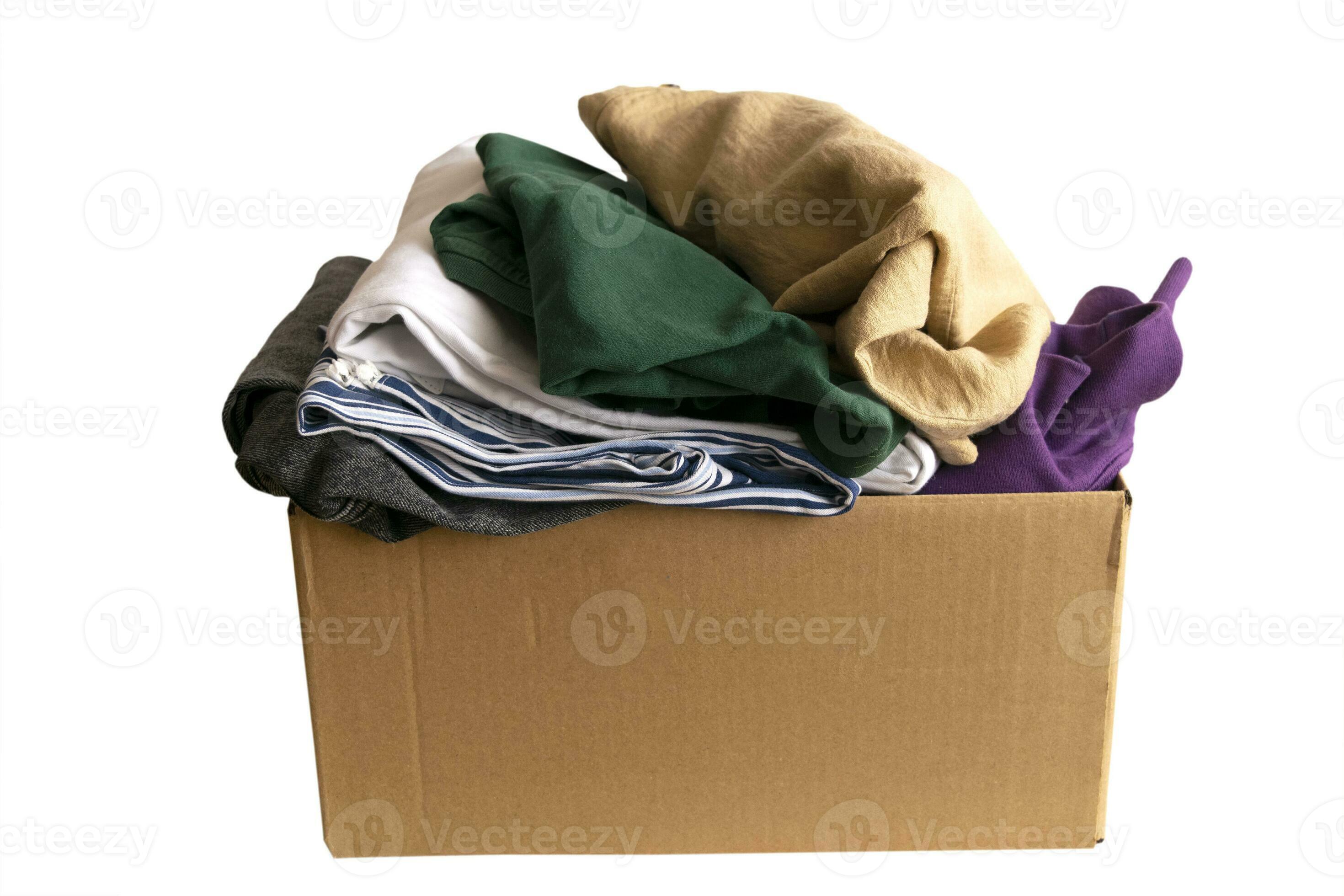 Woman packs clothes in boxes for donating. 23746046 Stock Photo at Vecteezy