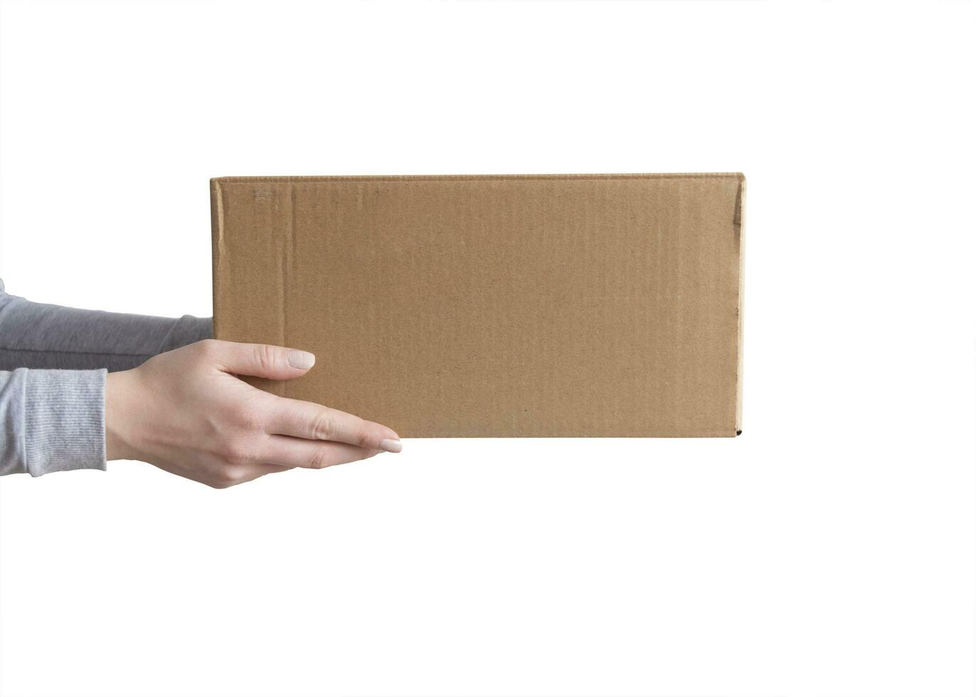 Delivery cardboard boxes in woman hand isolated photo