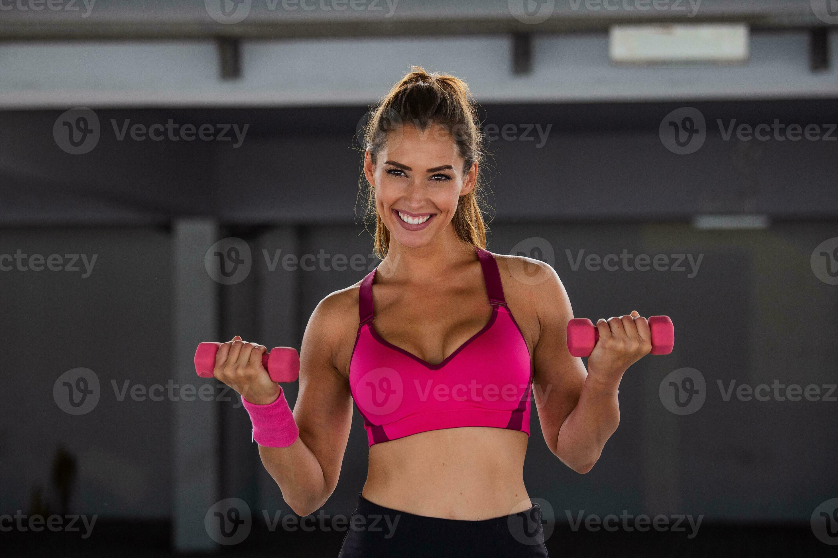 Athletic woman doing exercise for arms. Fitness model working out