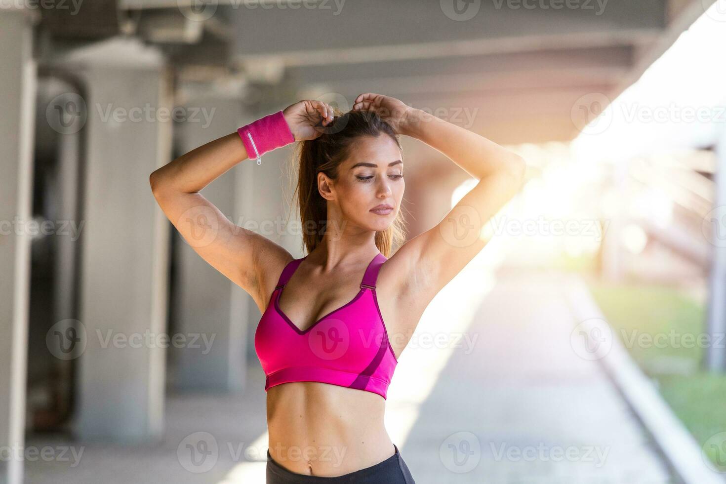 Healthy sports lifestyle. Athletic young woman in sports dress doing fitness exercise. Fitness woman streching Relaxing after training. photo