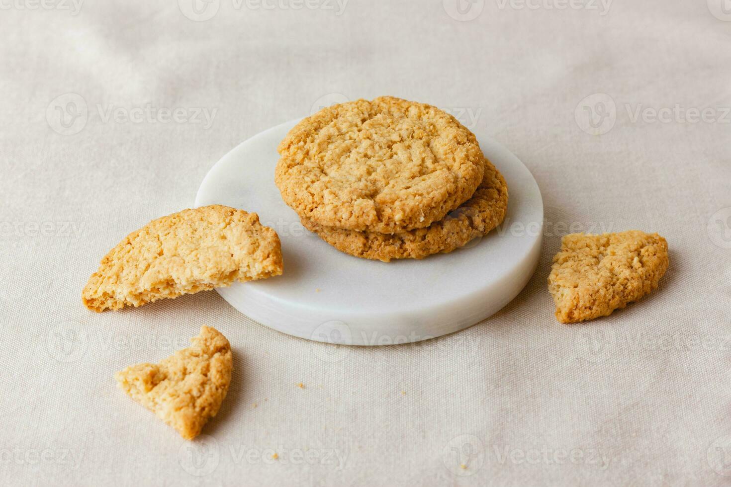 Oatmeal cookies on a marble stand photo