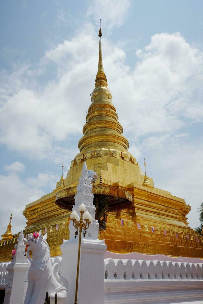 Beautiful Ancient grand golden pagoda of Wat Pumin Pratad Temple in northern of Thailand photo