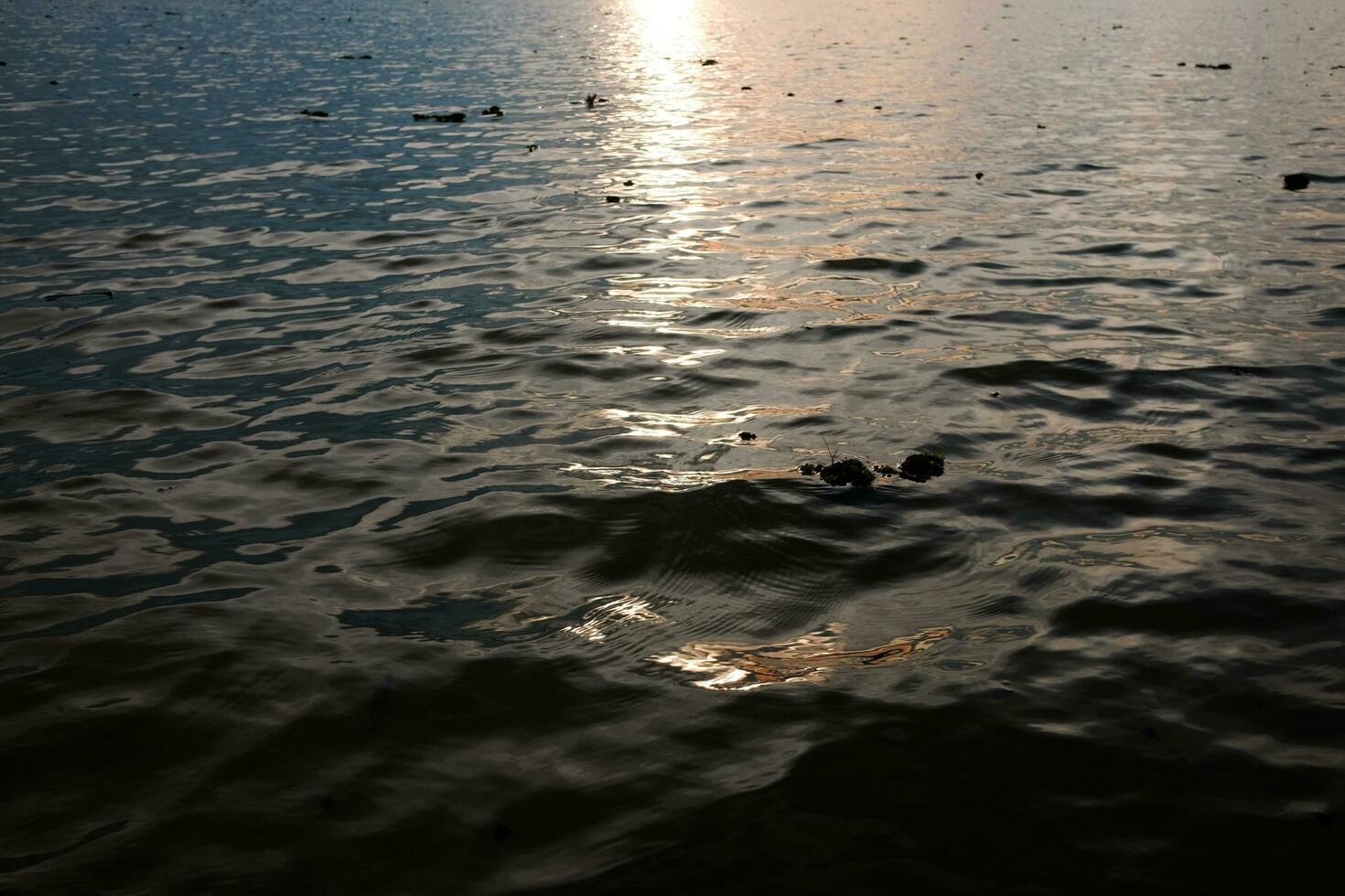 Destination of Beautiful Silhouette and  twilight of sunset Reflected light on the water surface and glittering waves in the River photo