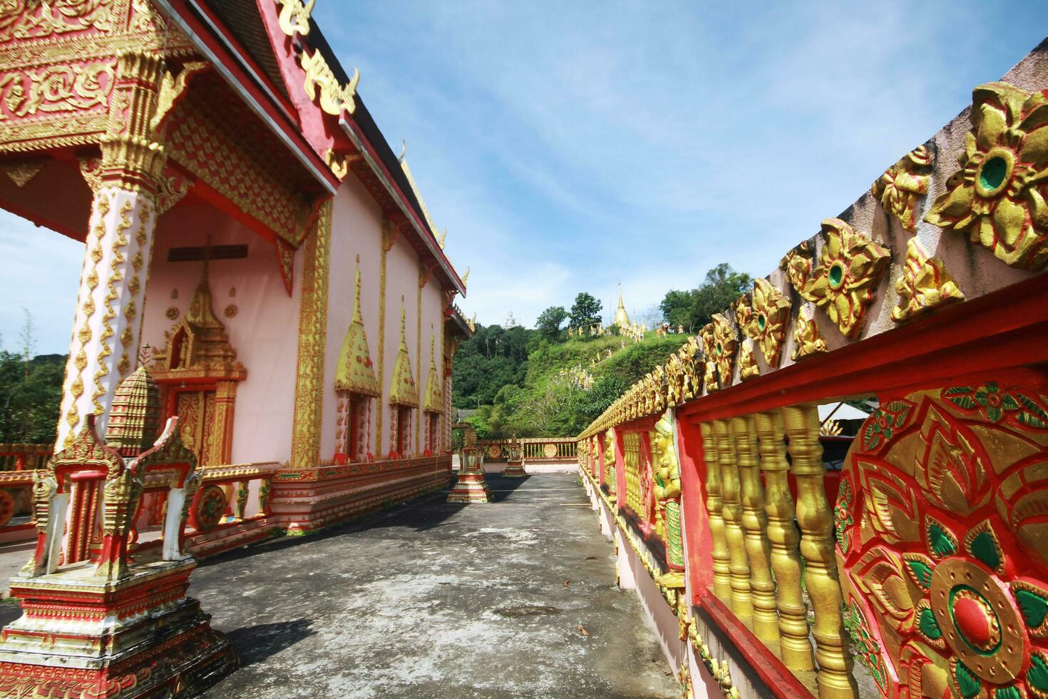 Heritage Golden temple located on the mountain of Thai and Myanmar border at Kanchanaburi Province, Thailand photo