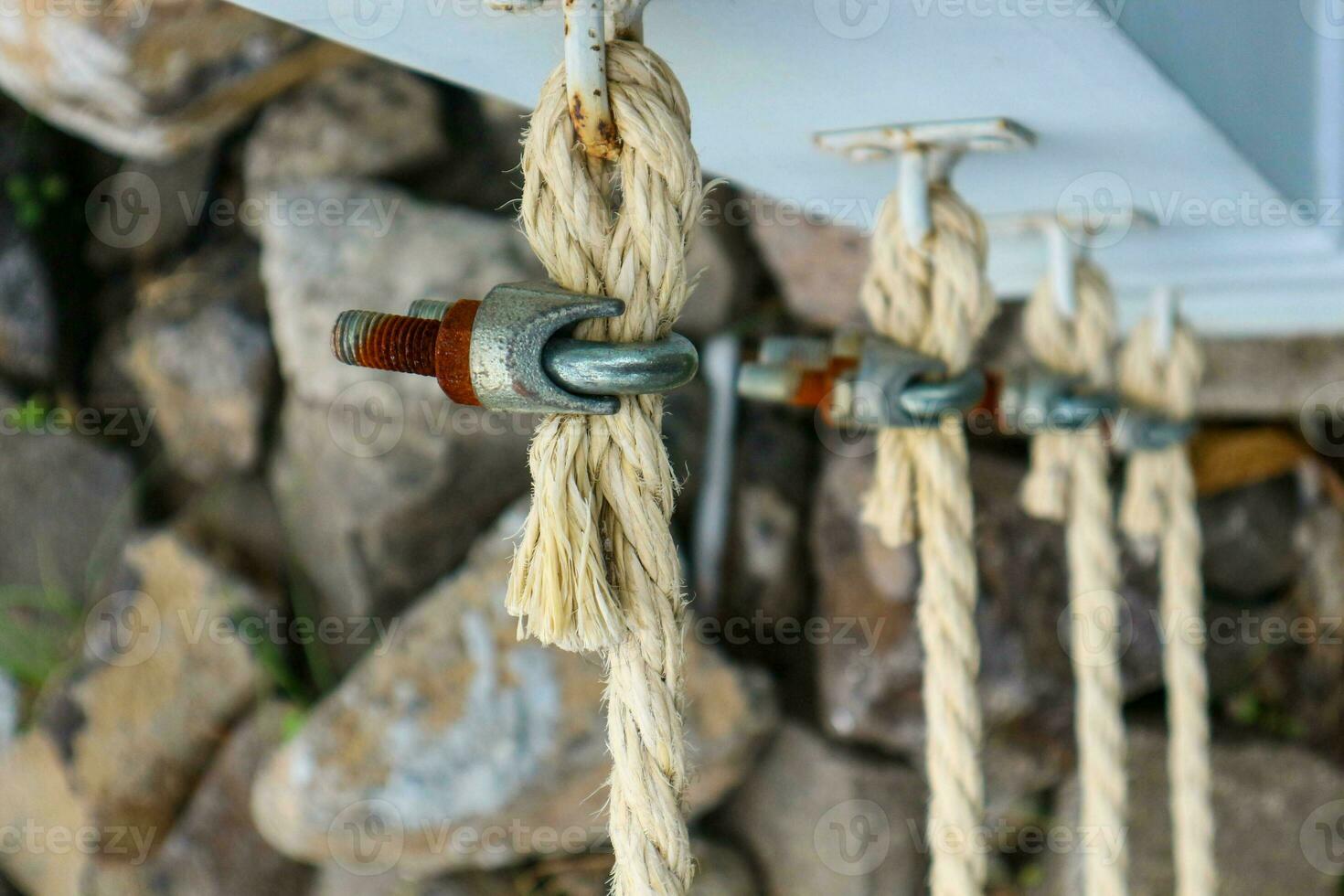 Rope for boats is a collection of linear plies, threads or strands that are twisted or braided together photo