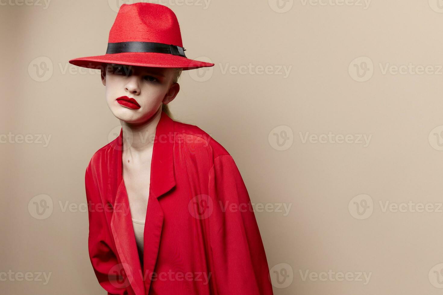 glamorous woman in a red hat and jacket makeup isolated background photo