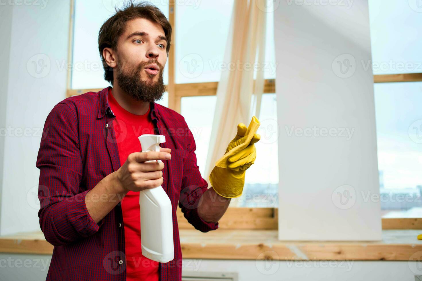 Cheerful cleaner detergent rubber gloves interior window in the background photo