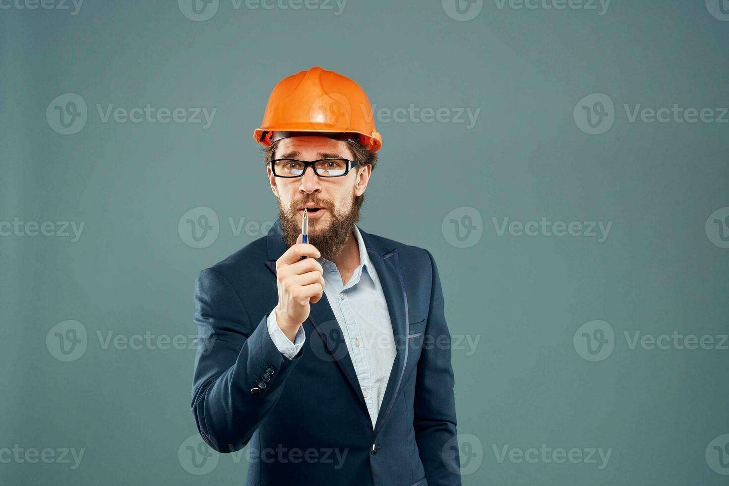 Business man in suit orange hard hat industry official Professional photo