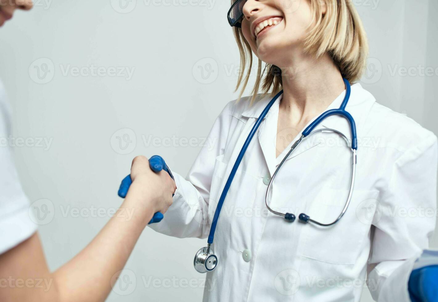 Nurse and patient gestures with hands light background stethoscope disease photo