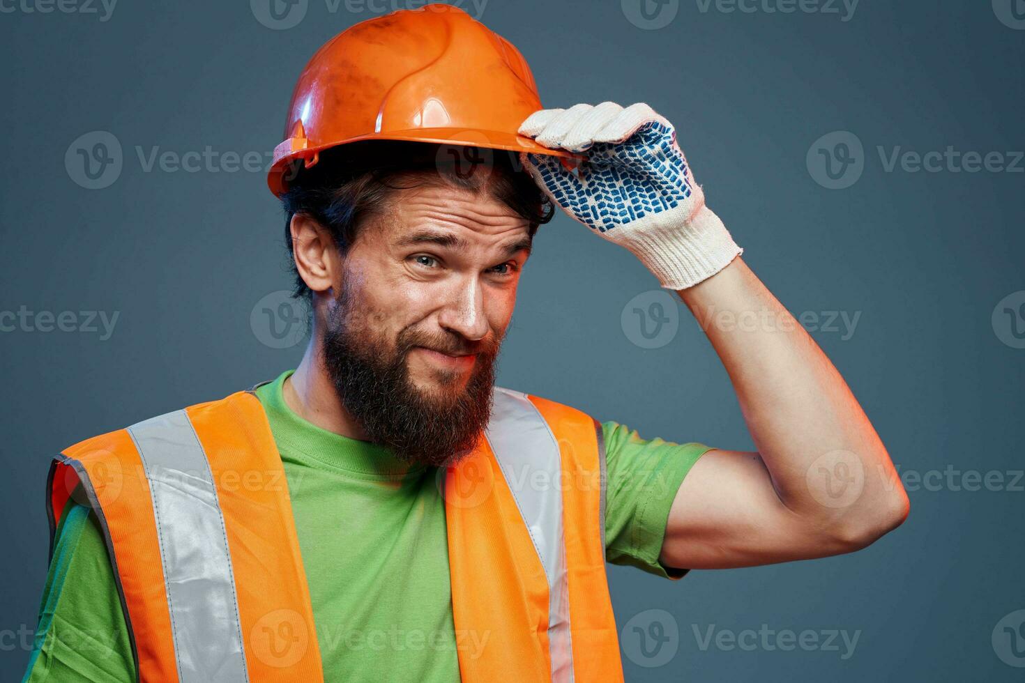 A man in orange paint. Hard work of a builder photo