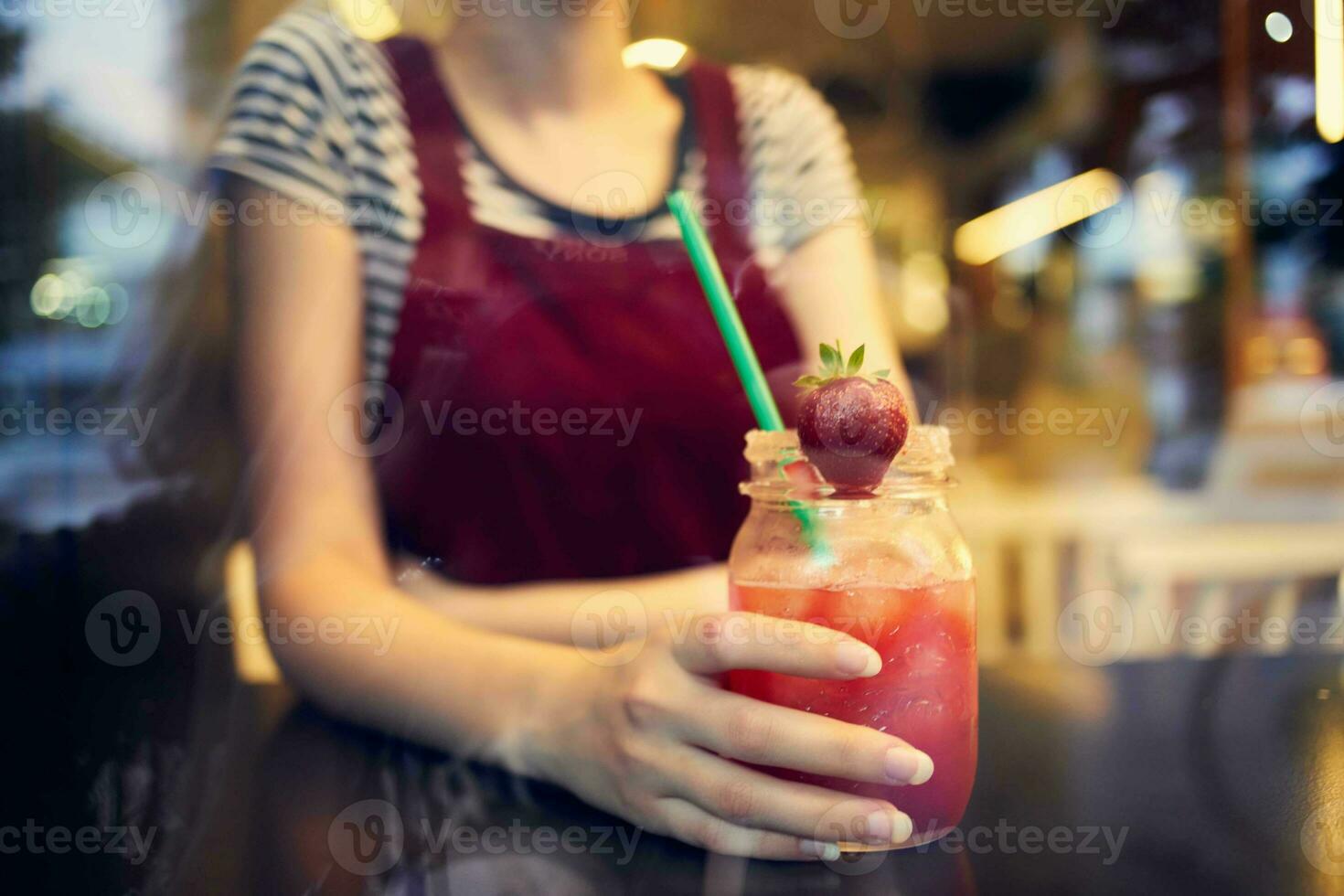 woman sitting in a cafe with a cocktail one lifestyle leisure photo