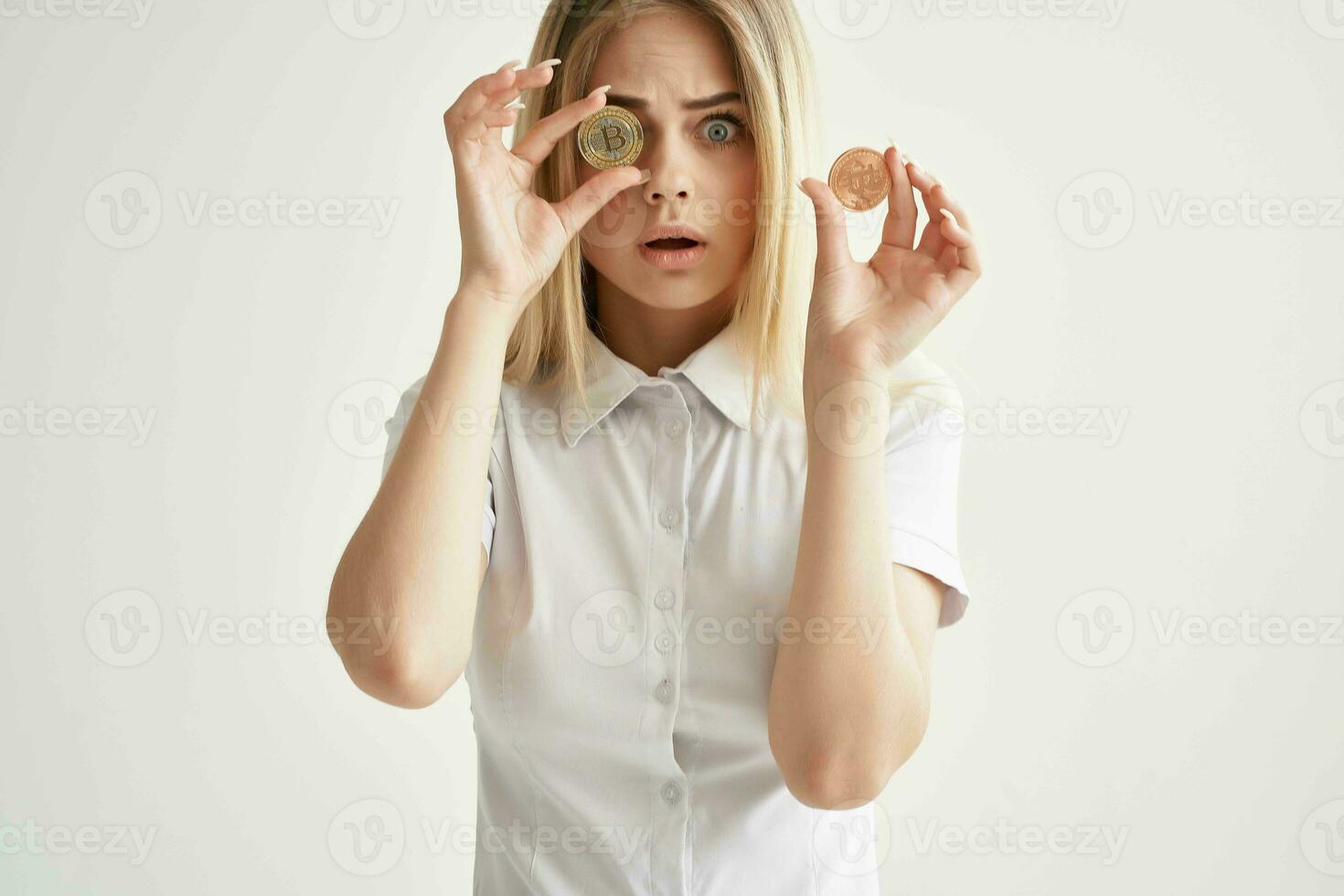 cheerful woman Bitcoin cryptocurrency in hands isolated background photo