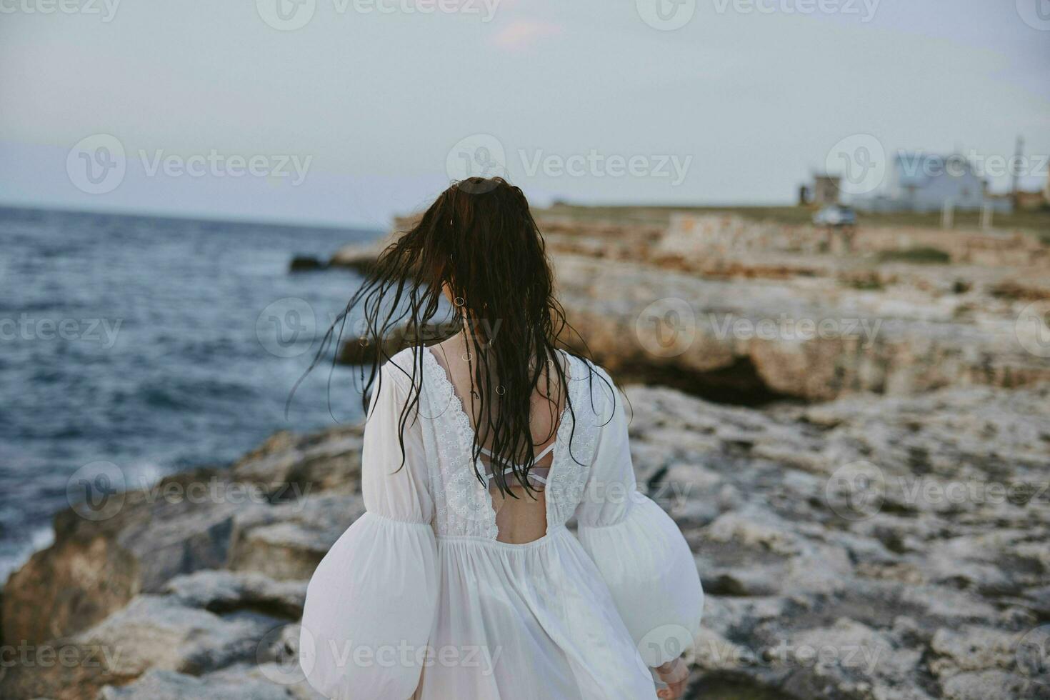 Woman in white dress summer walk ocean landscape travel photo