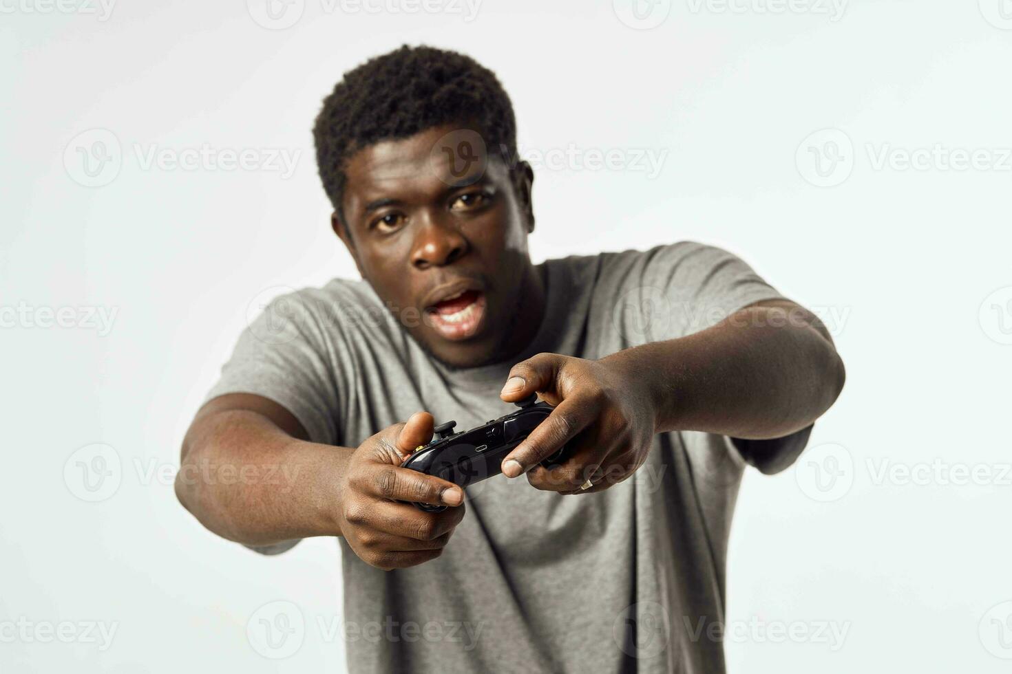 man african appearance with gamepad in hands playing entertainment technology photo