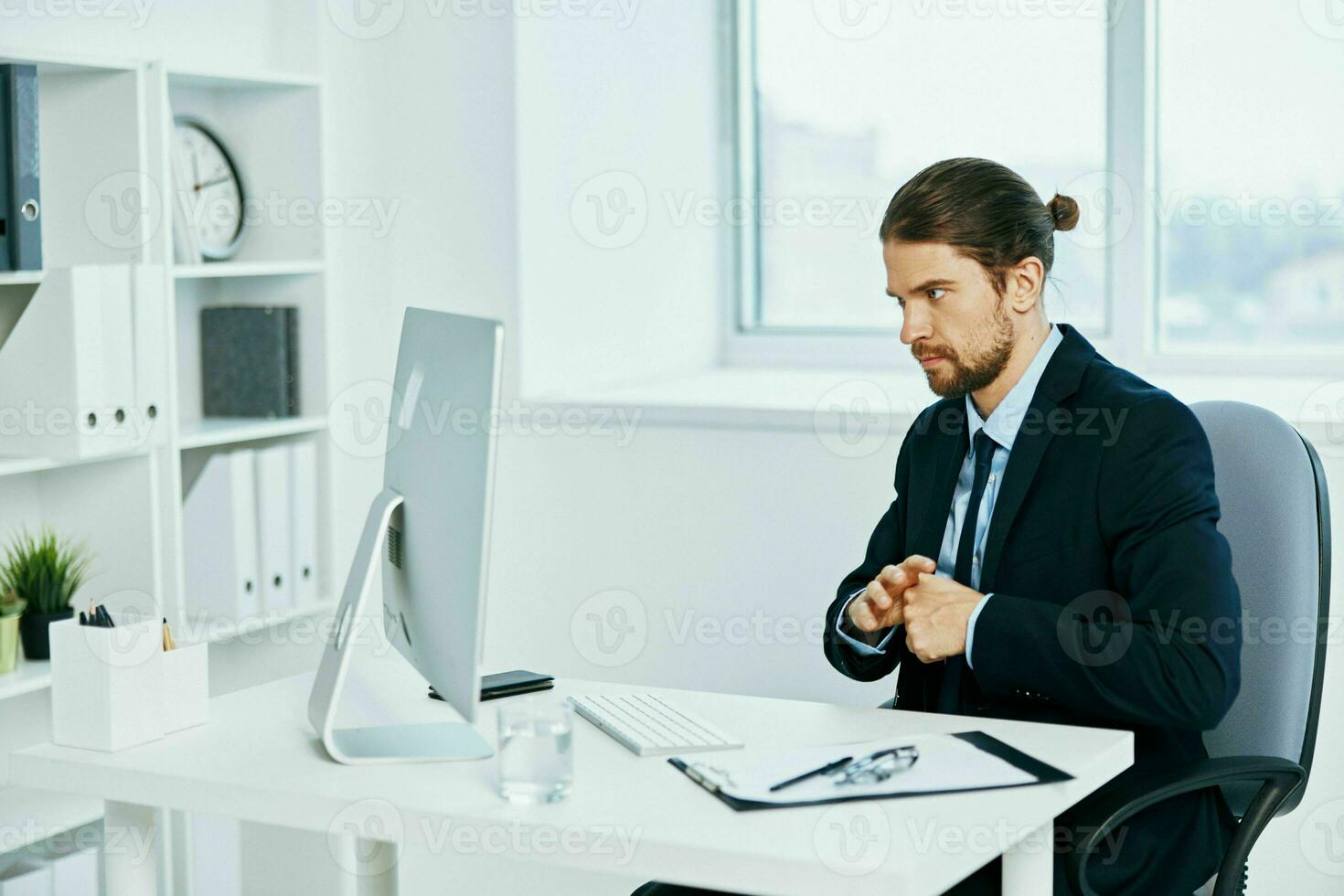 businessman work in front of a computer documents executive photo