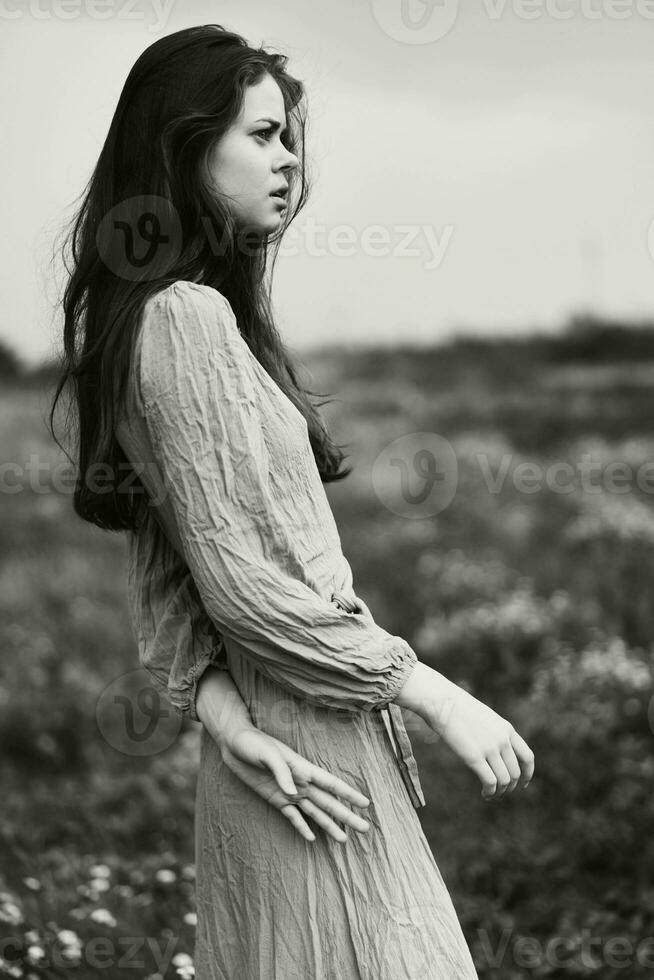 portrait of a beautiful woman in dress dramatic style emotions posing black and white photo