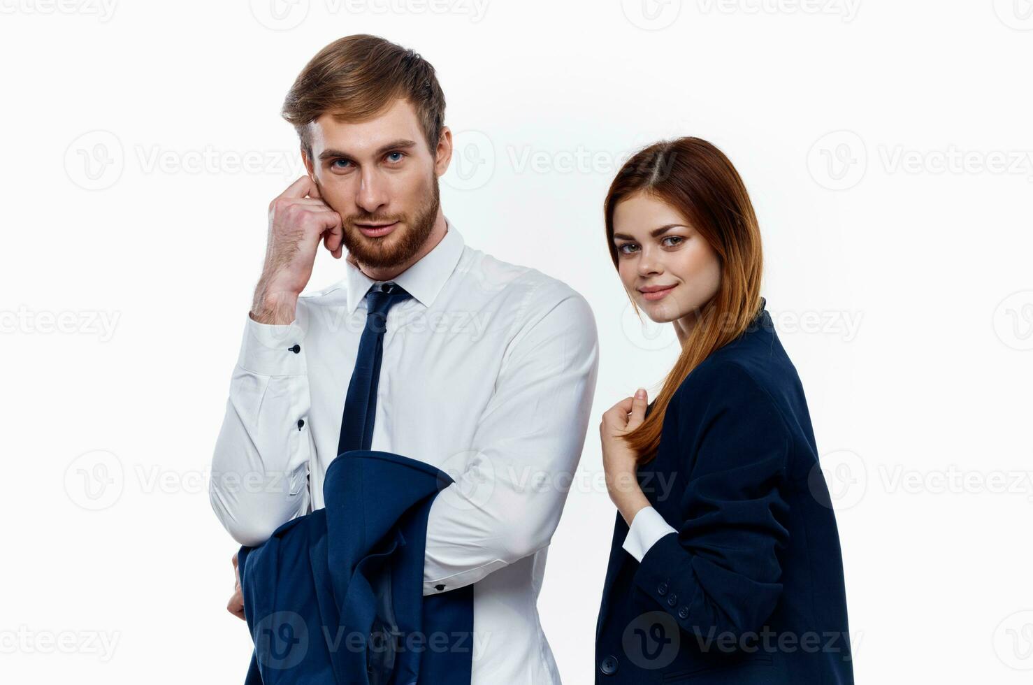 man and woman in suits are standing next to work colleagues finance office light background photo