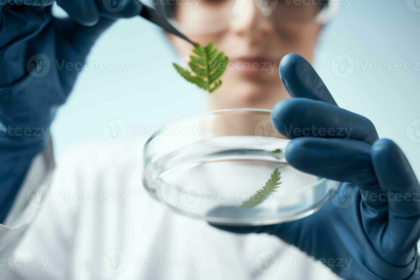 female laboratory assistant in white coat microbiology science work photo