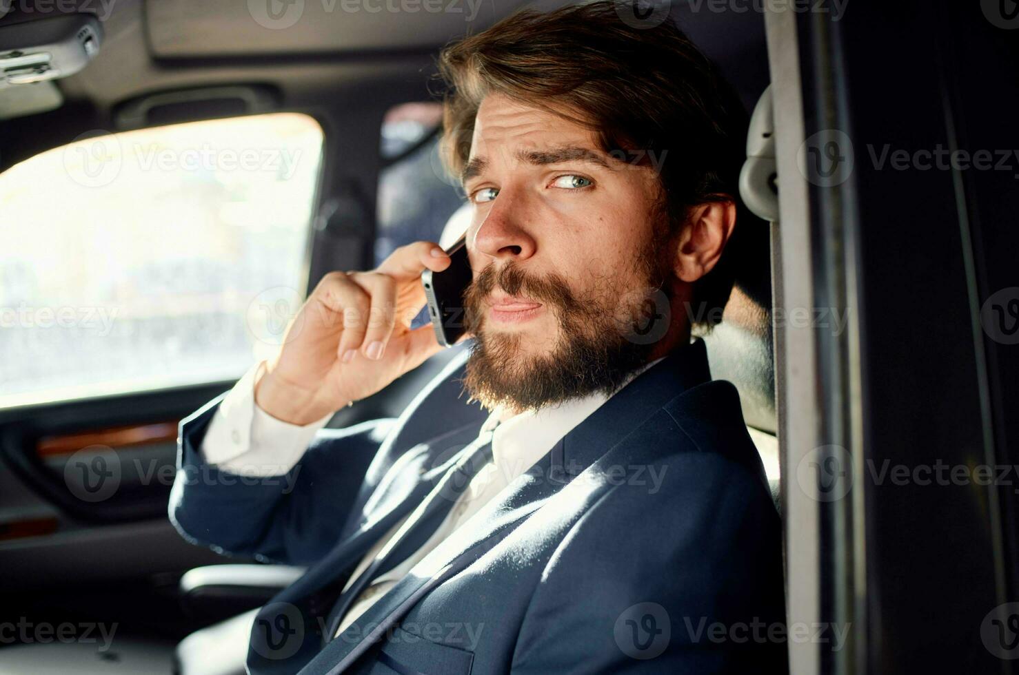 business man talking on the phone official trip to photo