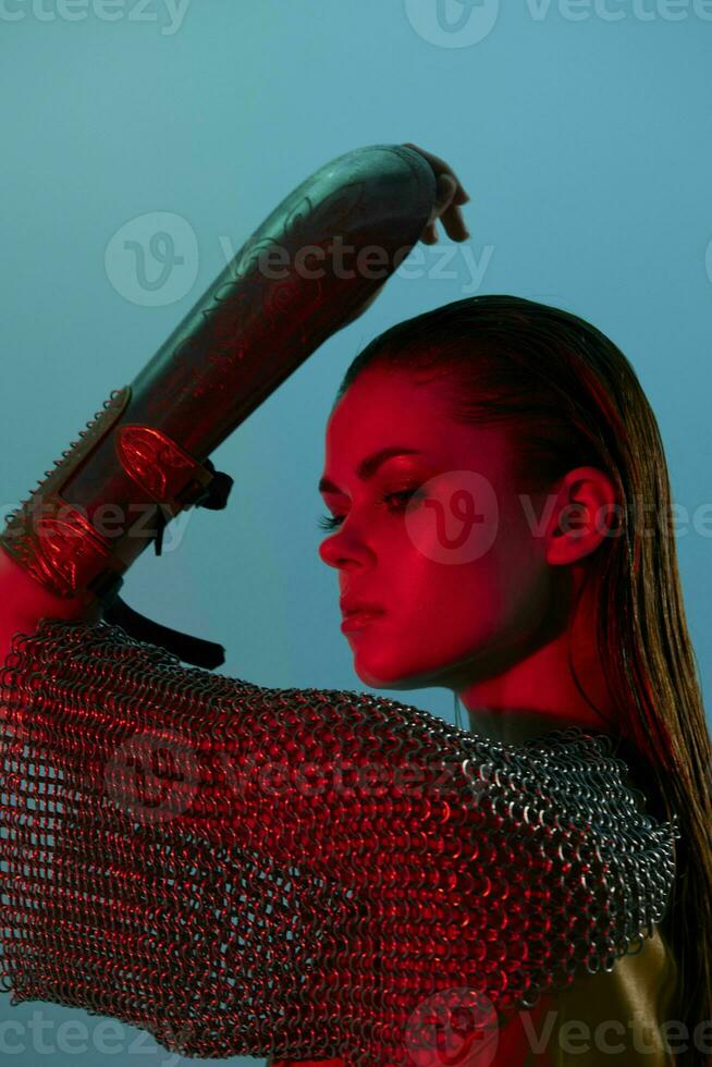 beautiful woman in dress arm in armor chain mail protection unaltered photo