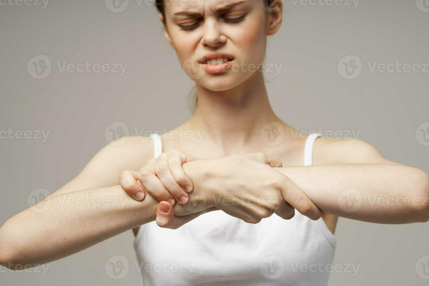 disgruntled woman rheumatism arm pain health problems isolated background 23760391 Stock Photo
