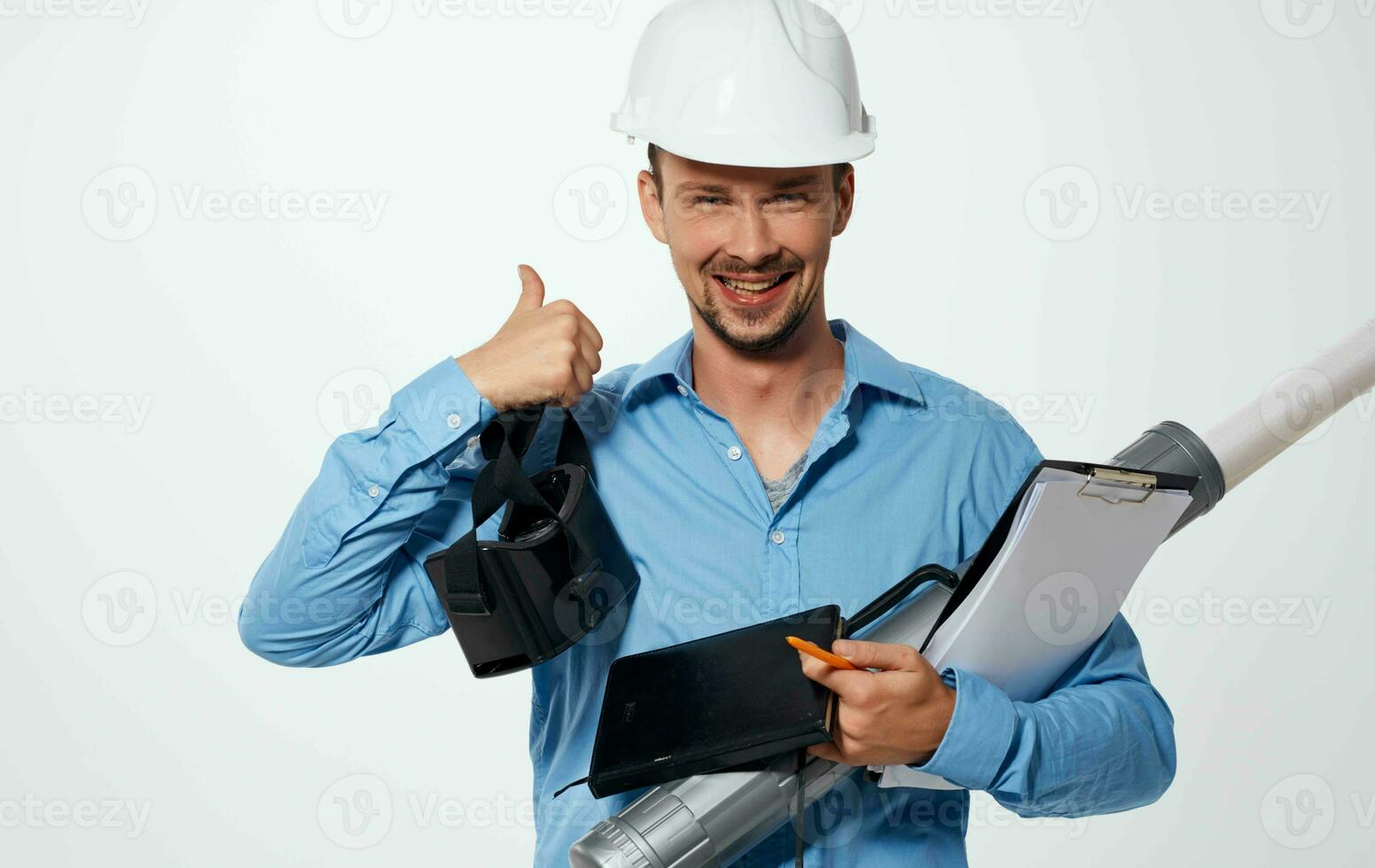 man in a construction helmet blueprints documents work engineer photo