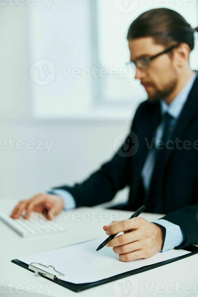 business man in suit work desk documents office photo