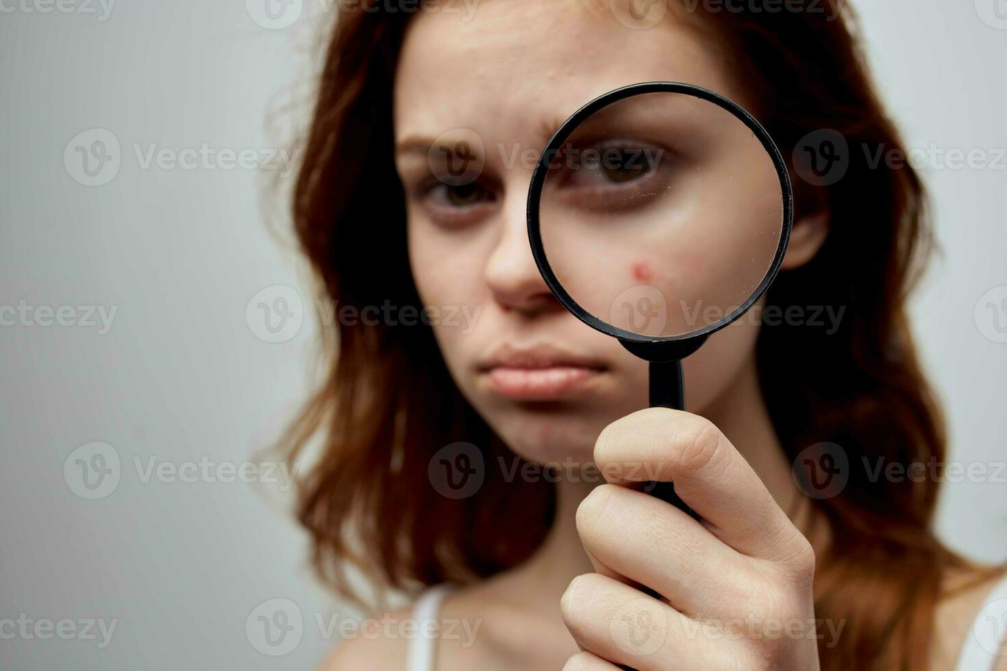 pretty woman with a pimple on the face cosmetology Studio photo