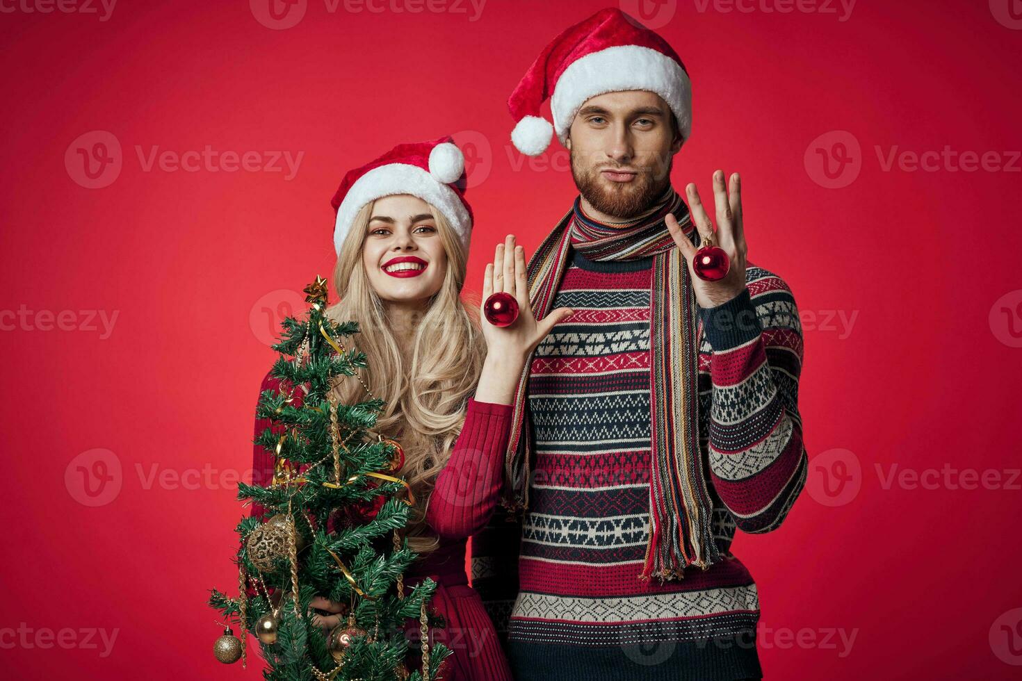 cheerful married couple in new year clothes decorating lifestyle photo
