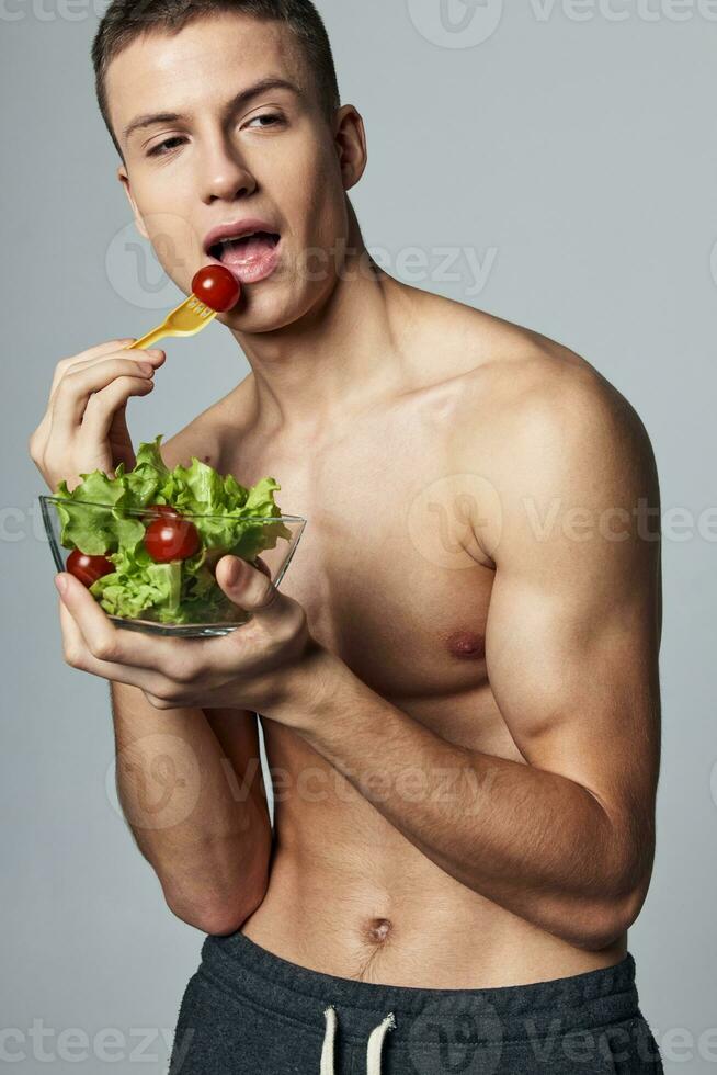 Man eat salad healthy food sport workout vitamins energy photo