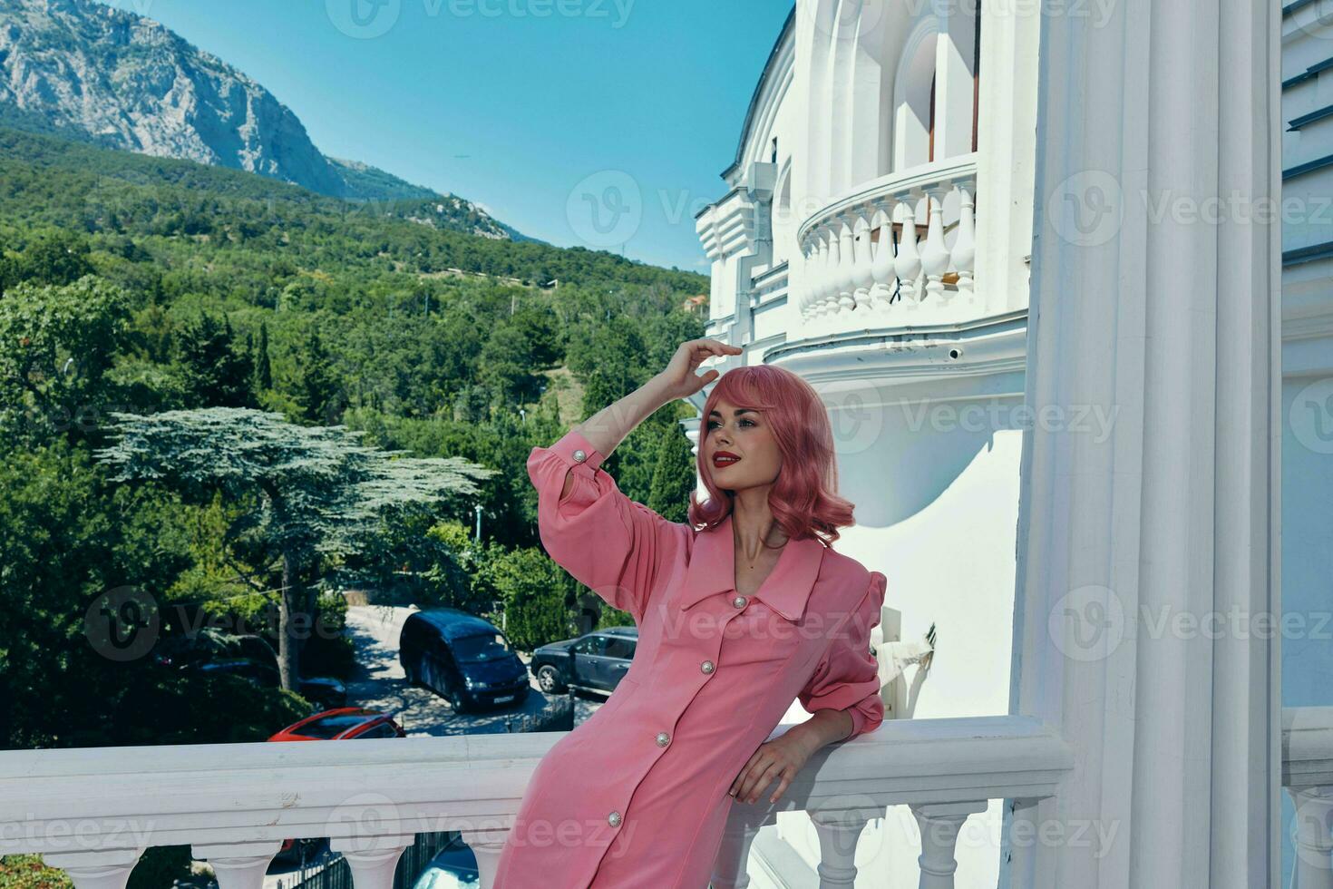 portrait of a woman posing on the terrace mountain view lifestyle Summer day photo