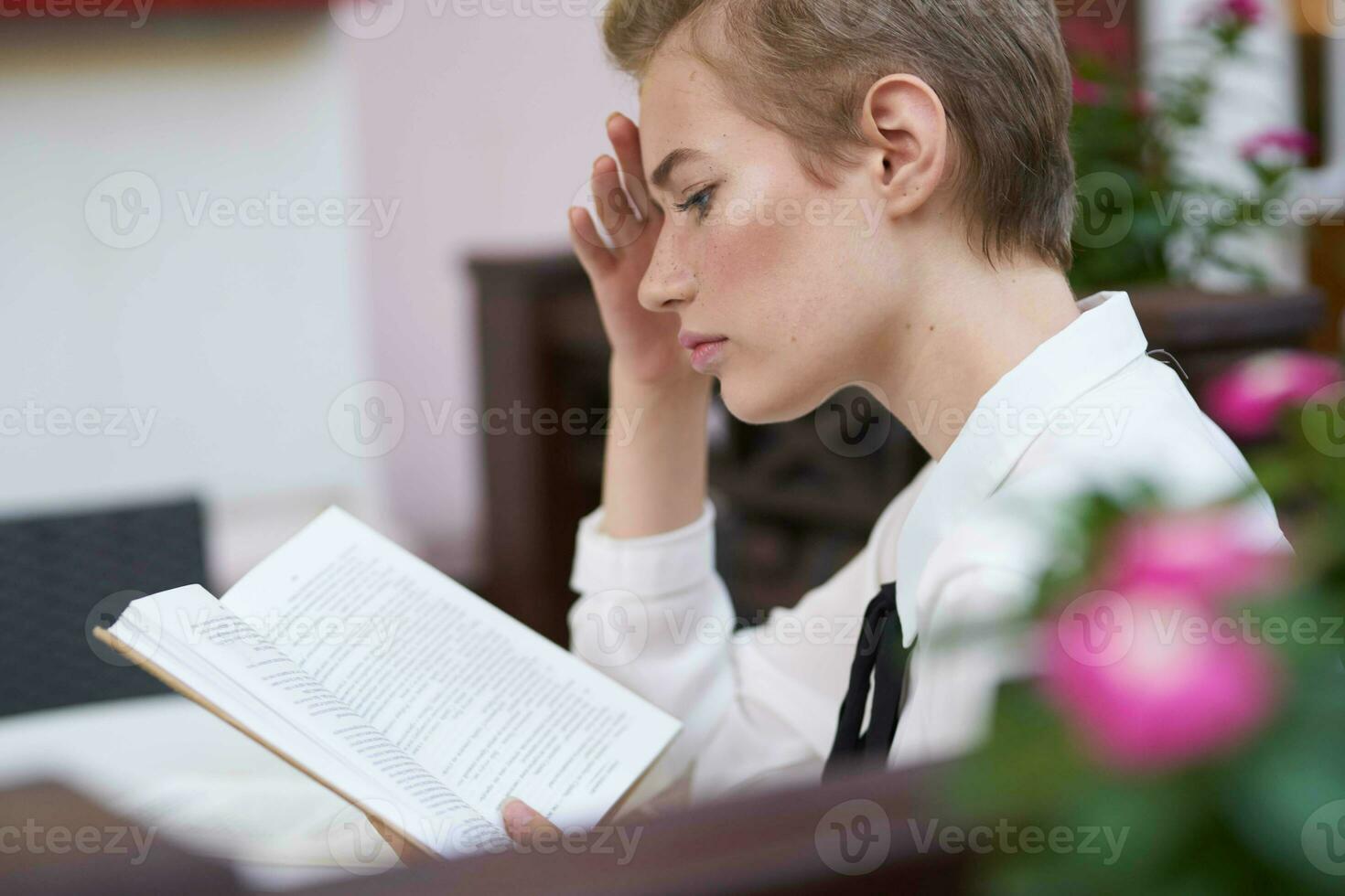 student with a book in his hands outdoors rest fun walking around town Lifestyle photo