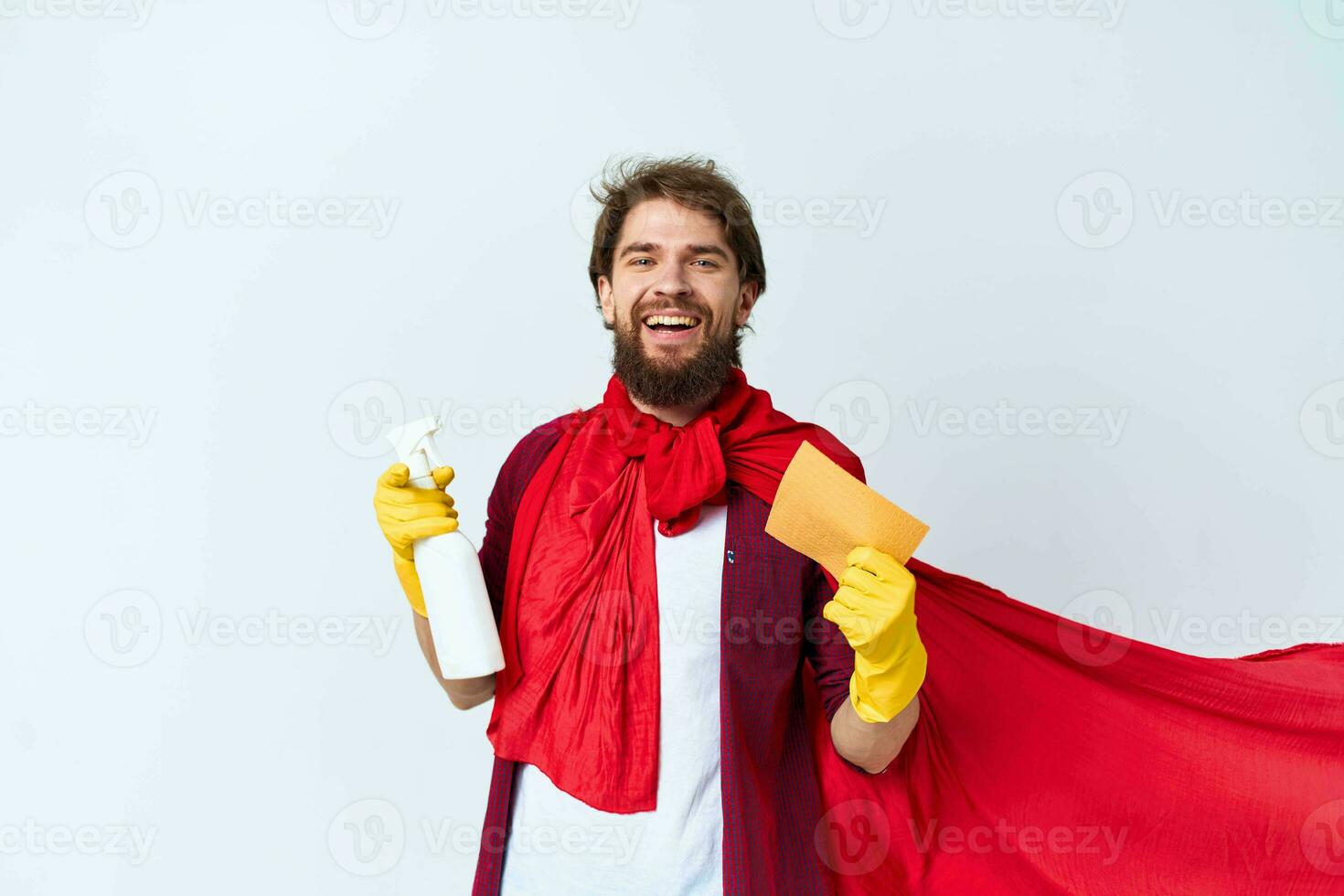 Emotional man in red raincoat detergent house cleaning service light background photo