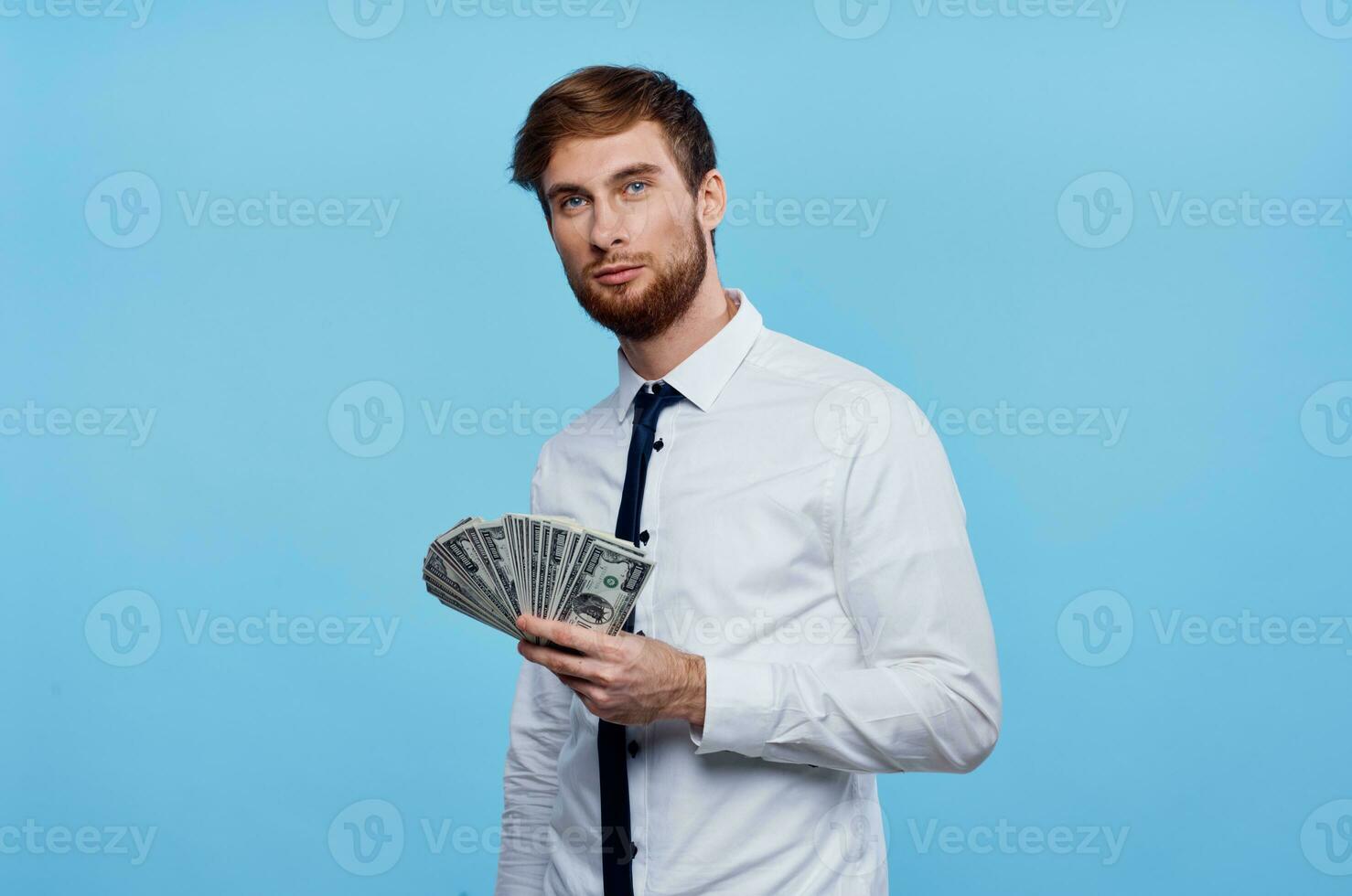 business man in shirt with tie bundle of money finance wealth photo