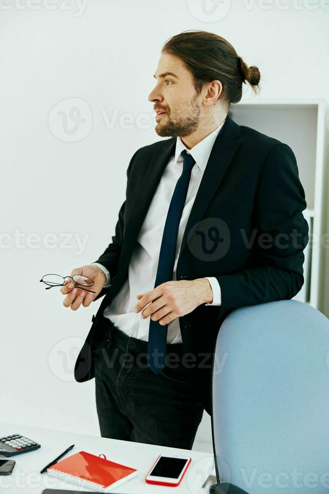 man in a suit in the office with documents executive photo