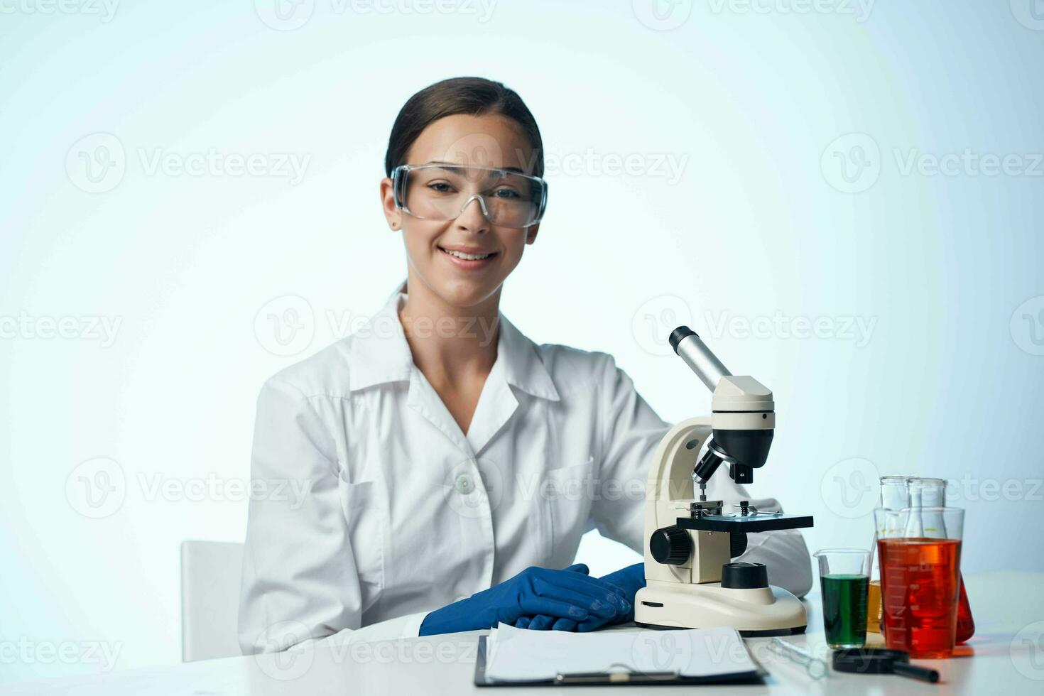 Cheerful woman laboratory assistant science microscope biotechnology photo
