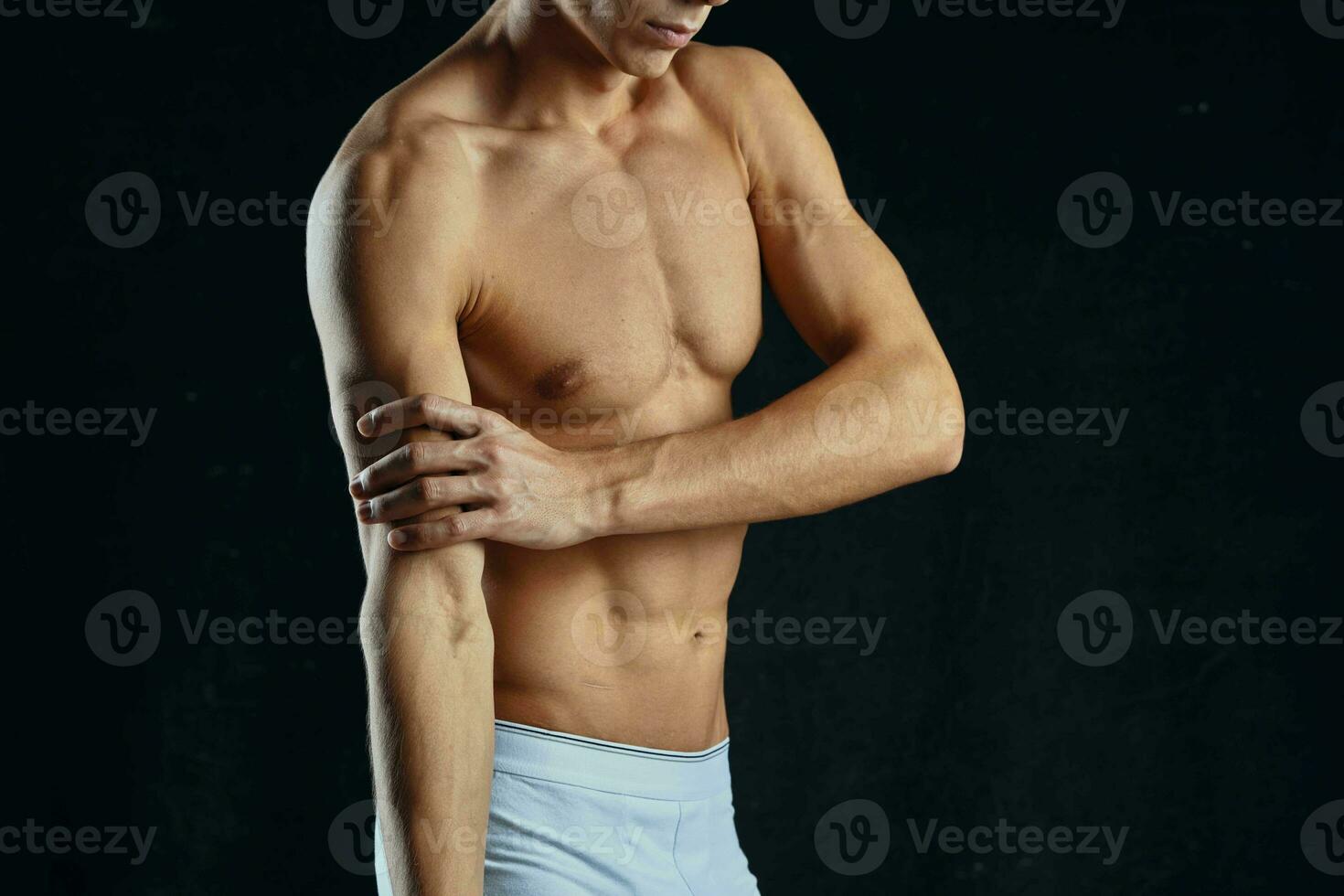 athletic man with pumped up abs workout fitness motivation photo