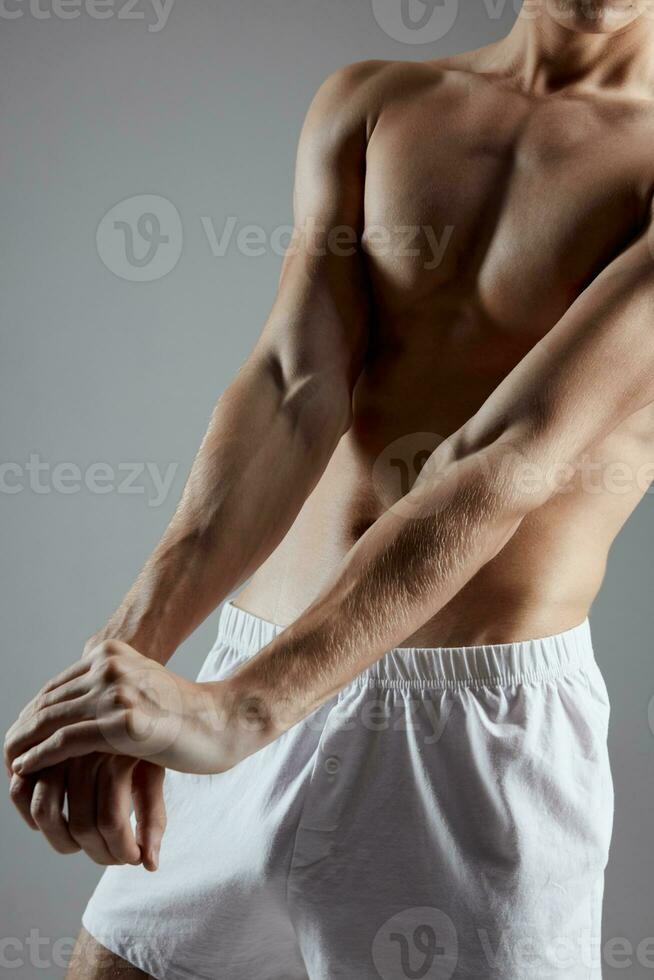 athlete with pumped muscles arm press cropped view photo