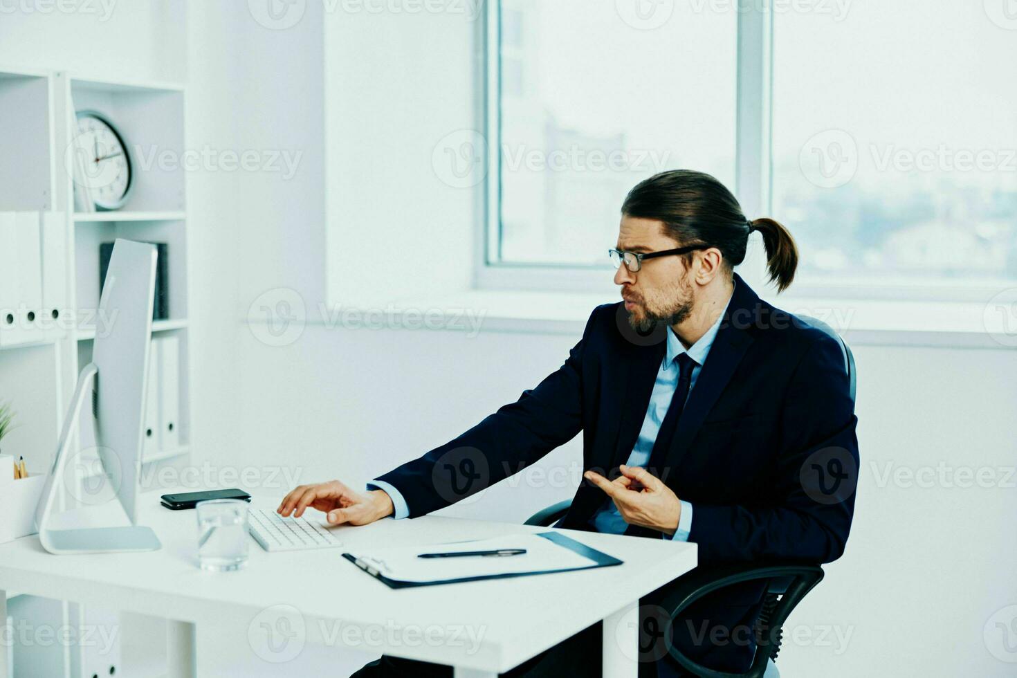 The man in a suit with glasses self-confidence work boss photo